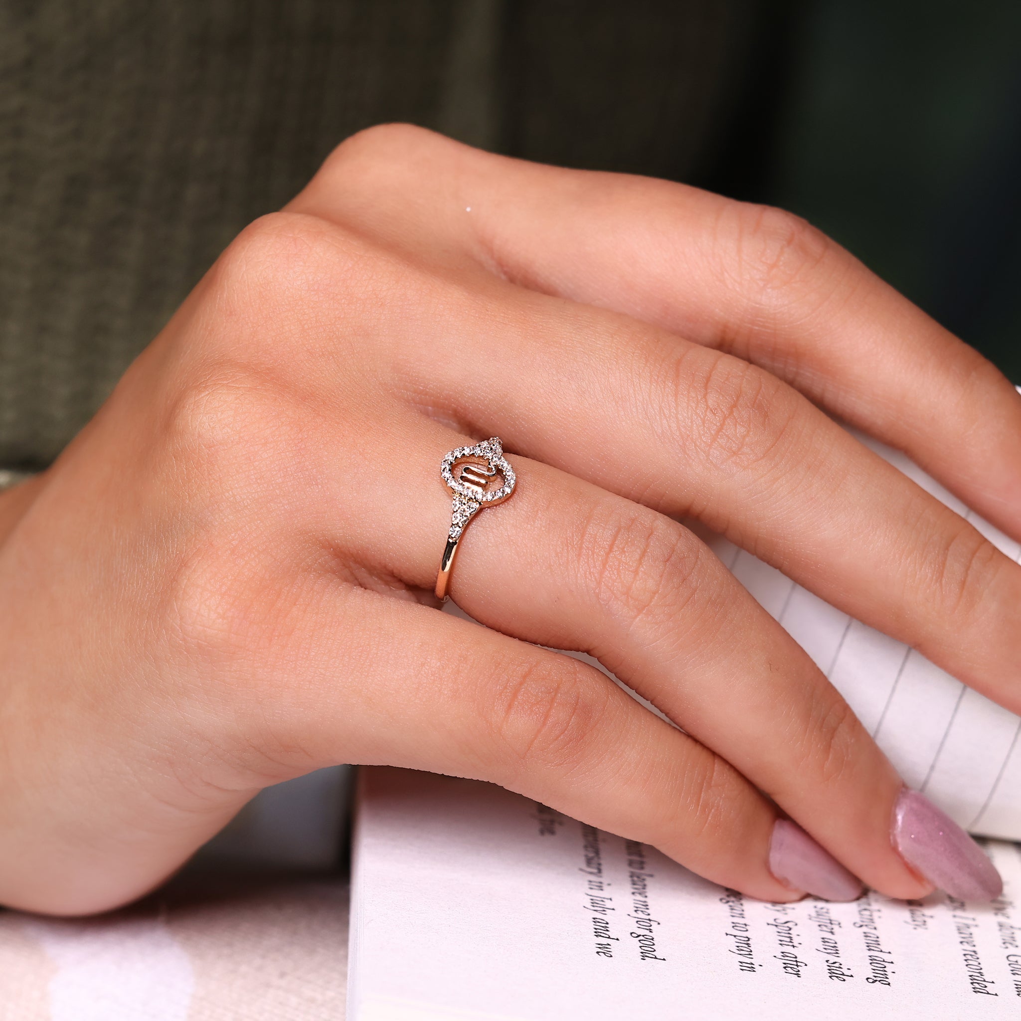 Zodiac sign ring with Scorpio horoscope and round cut side stones.

