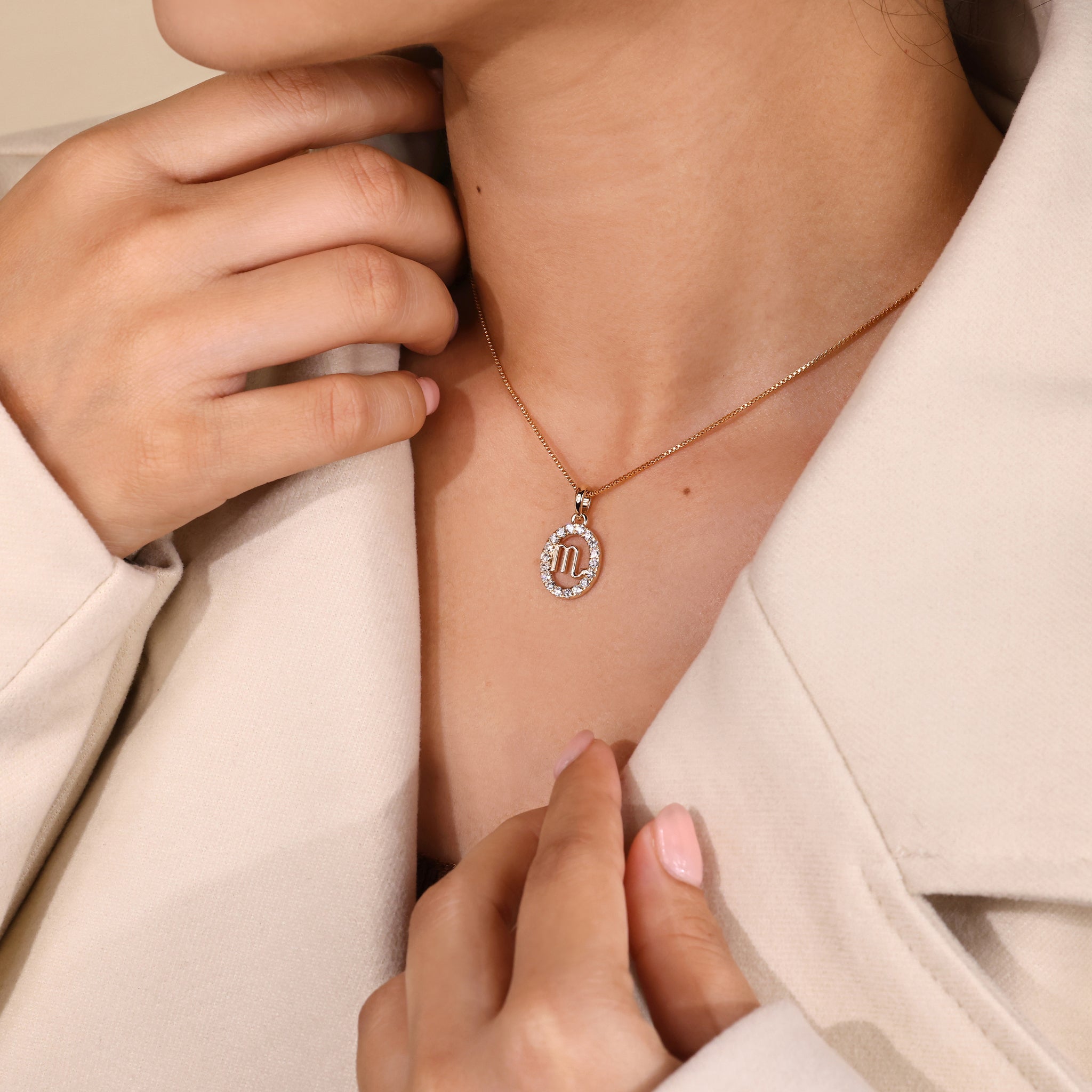 Yellow gold Scorpio pendant with astrology inspired zodiac symbol.