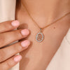 Custom pendant with Scorpio zodiac symbol and halo diamond centerpiece.