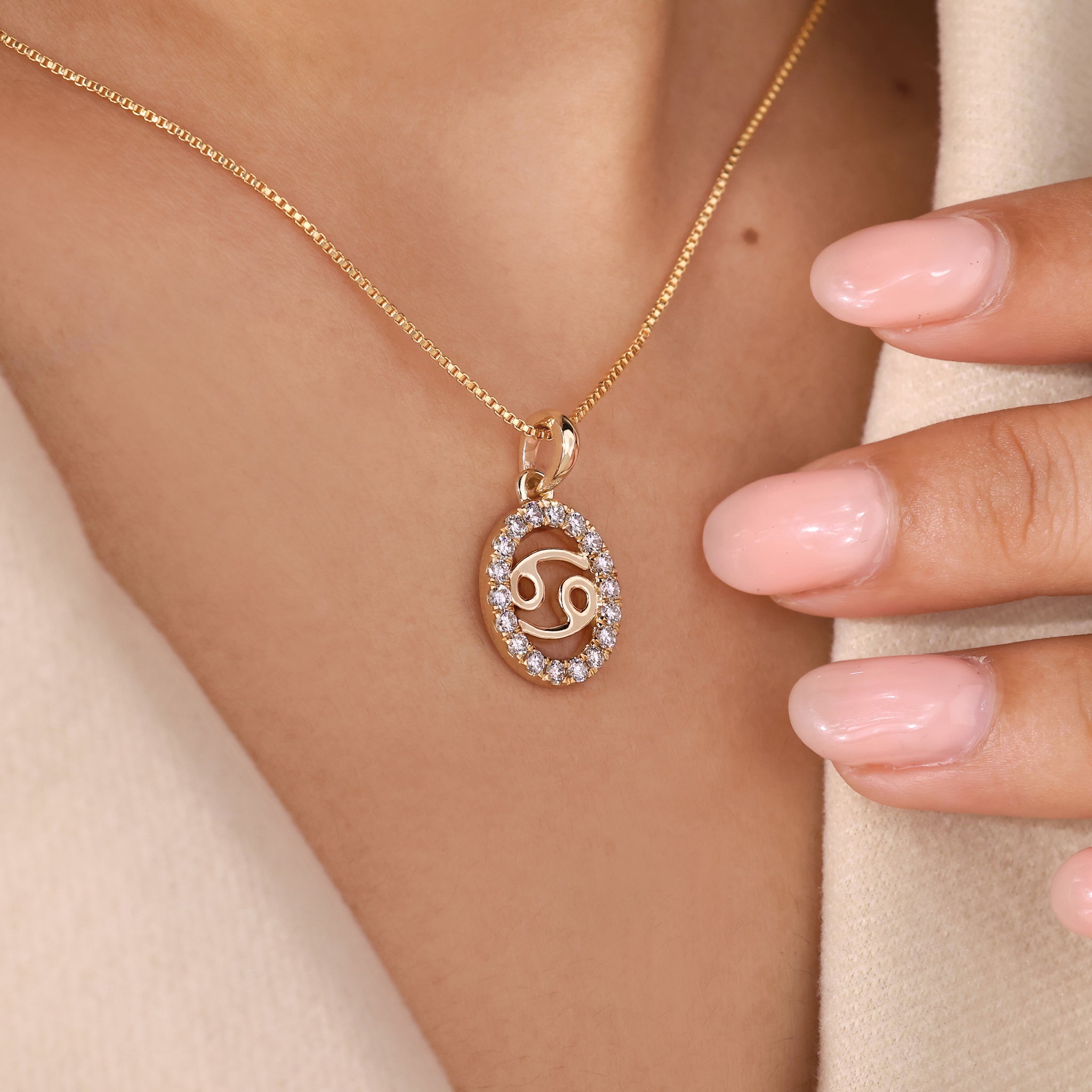 Custom pendant with Cancer zodiac symbol and halo diamond centerpiece.