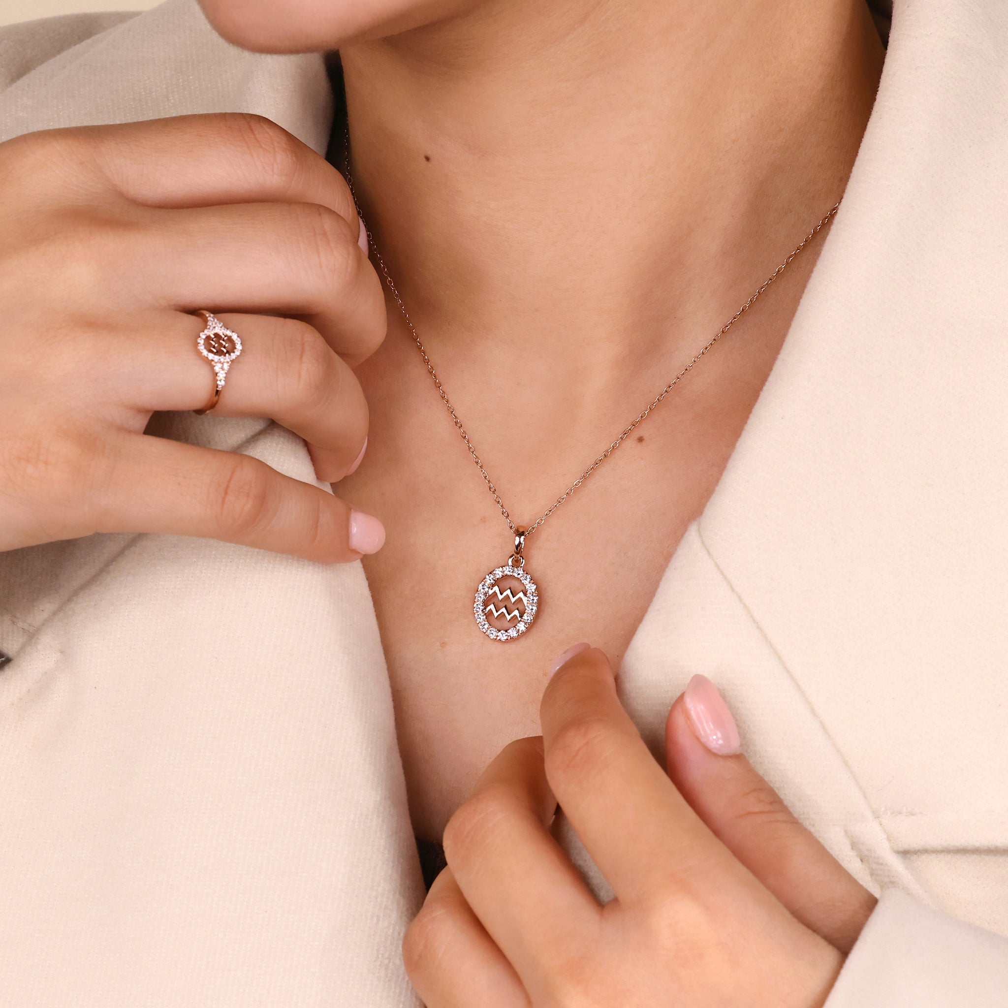 Astrology pendant featuring Aquarius constellation design in gold finish.