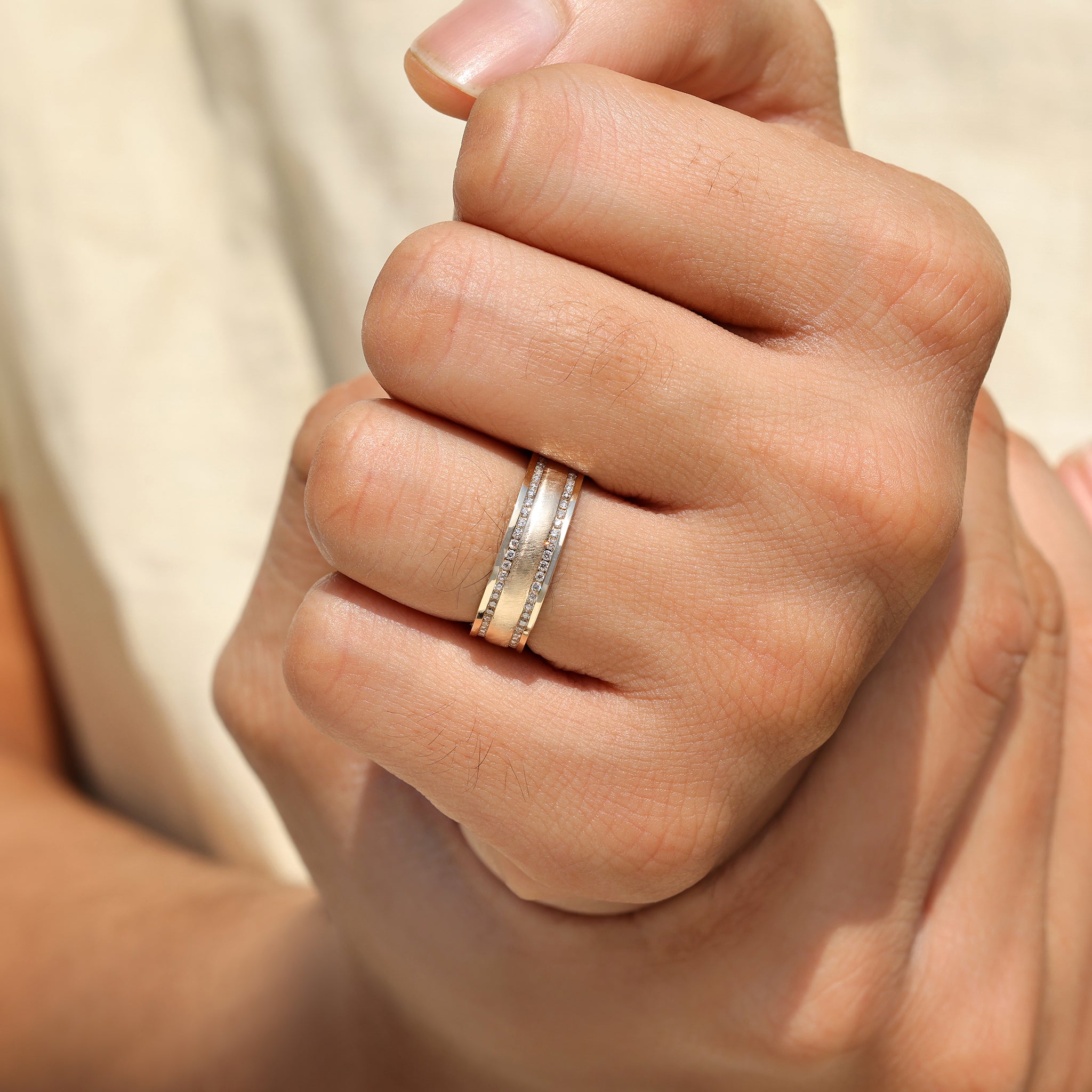 Men’s ring with round diamonds and matte finish design.
