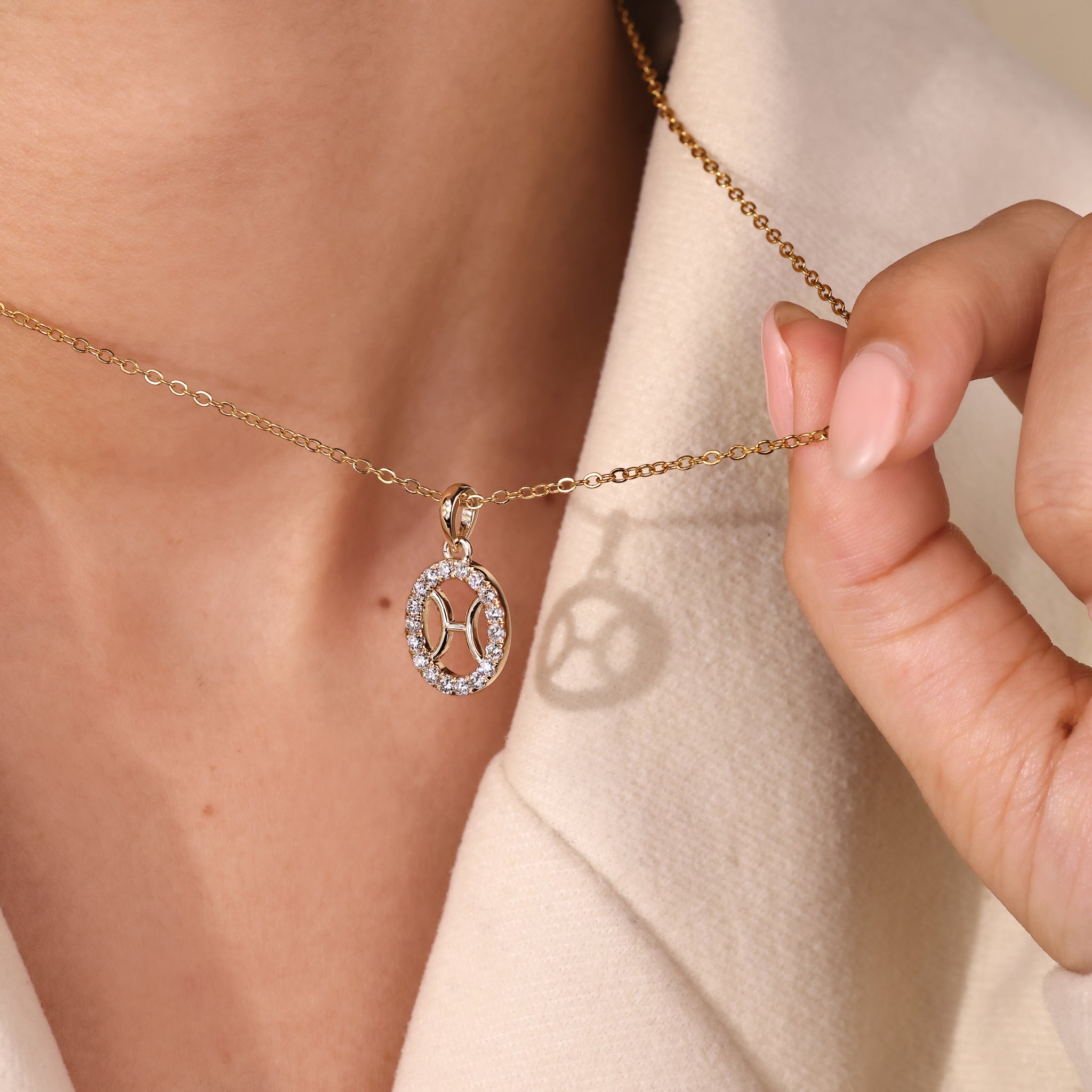 Custom Pisces constellation pendant in yellow gold by Carat Diamonds.