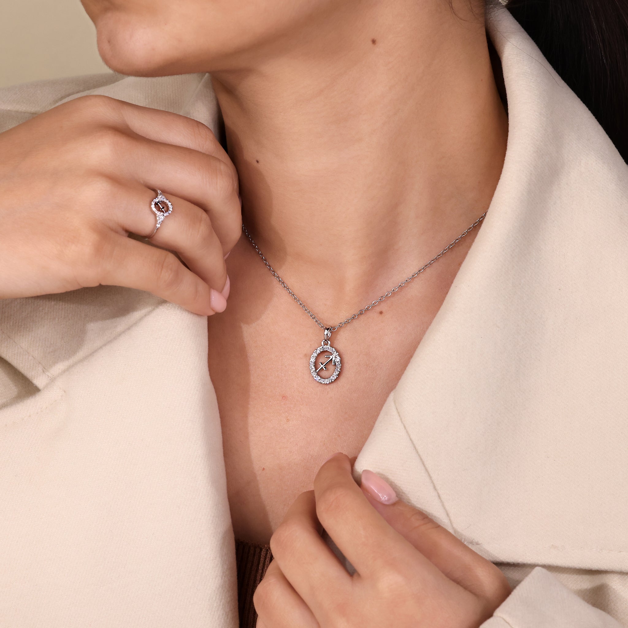 Round diamond halo Sagittarius pendant crafted as a zodiac-inspired accessory.