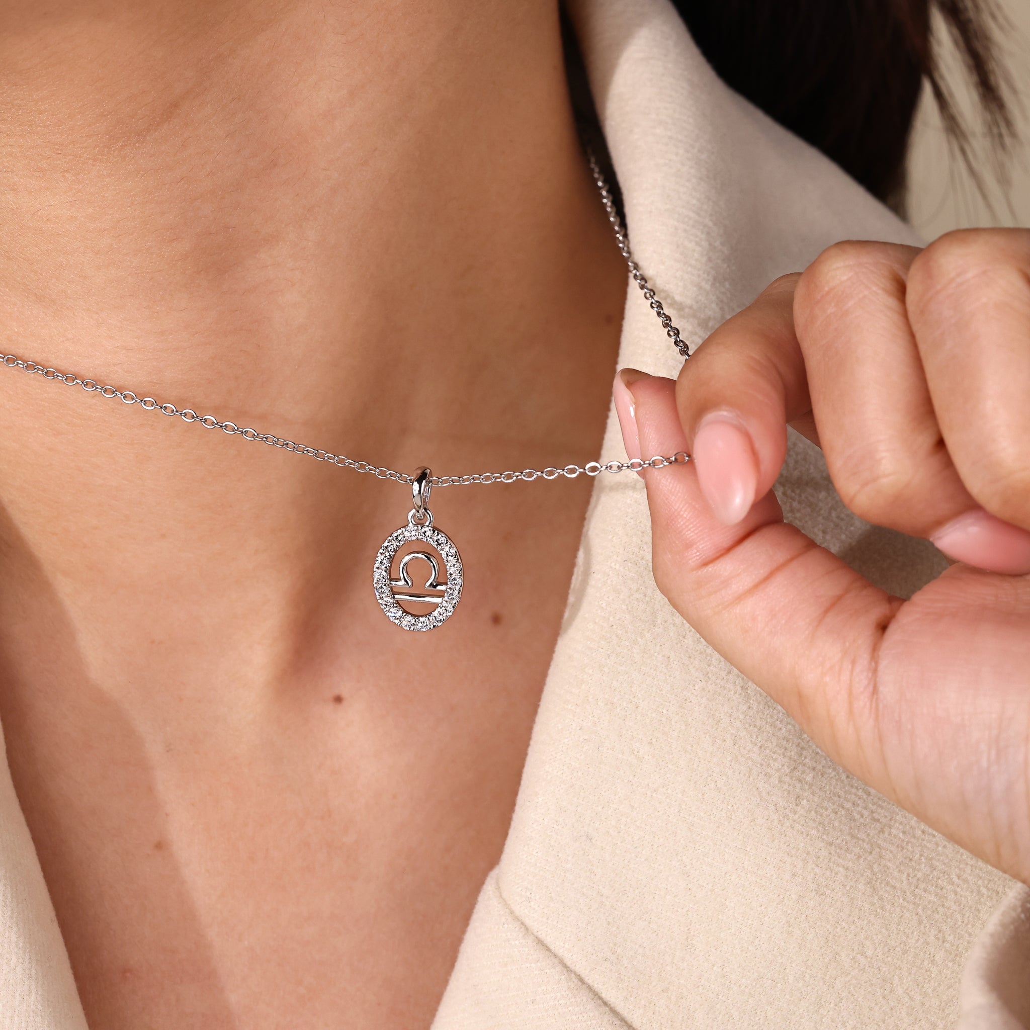 Halo style Libra pendant showcasing the constellation in white gold.
