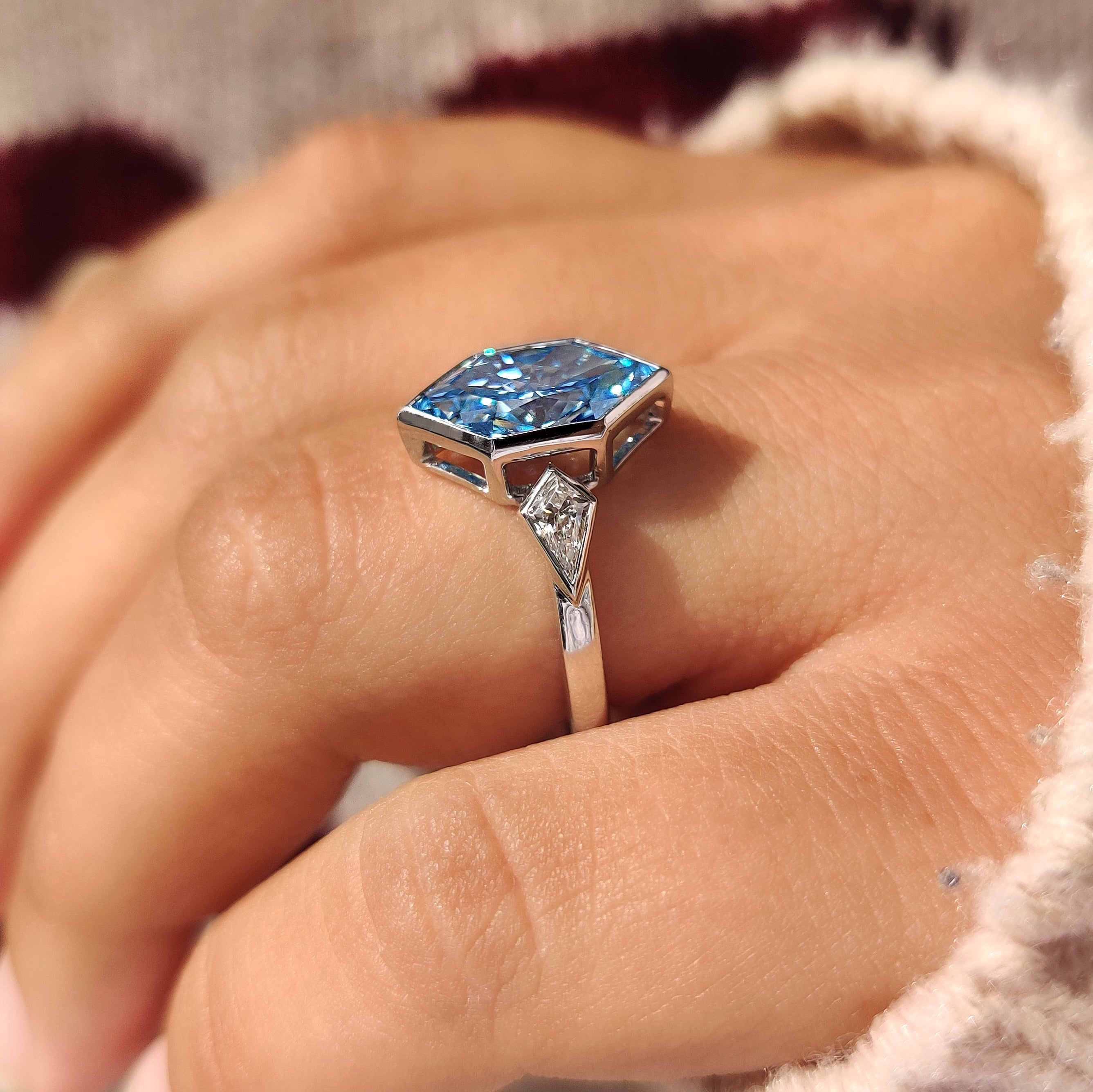 Blue dutch marquise diamond in three stone engagement ring
