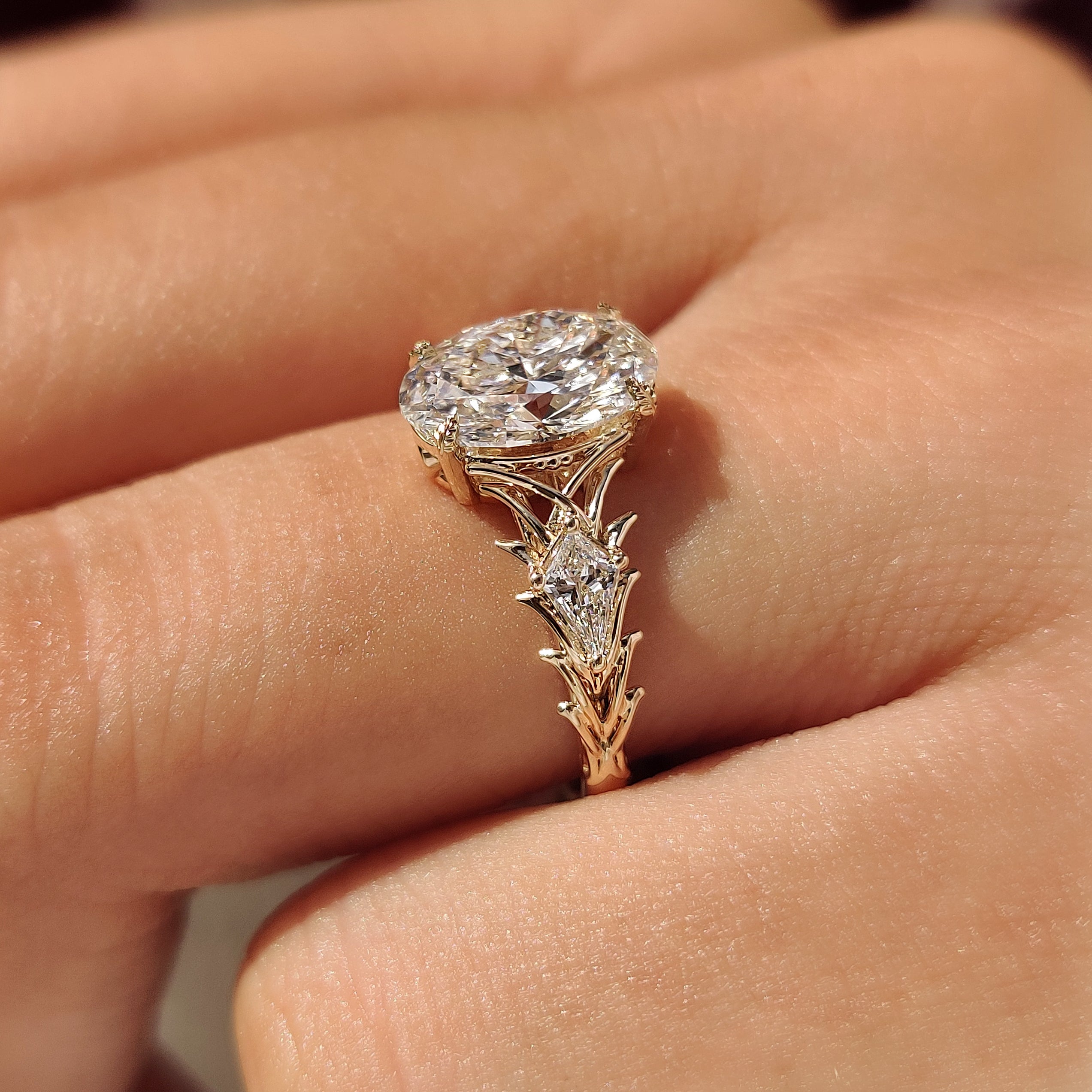 Leaf prong three stone engagement ring
