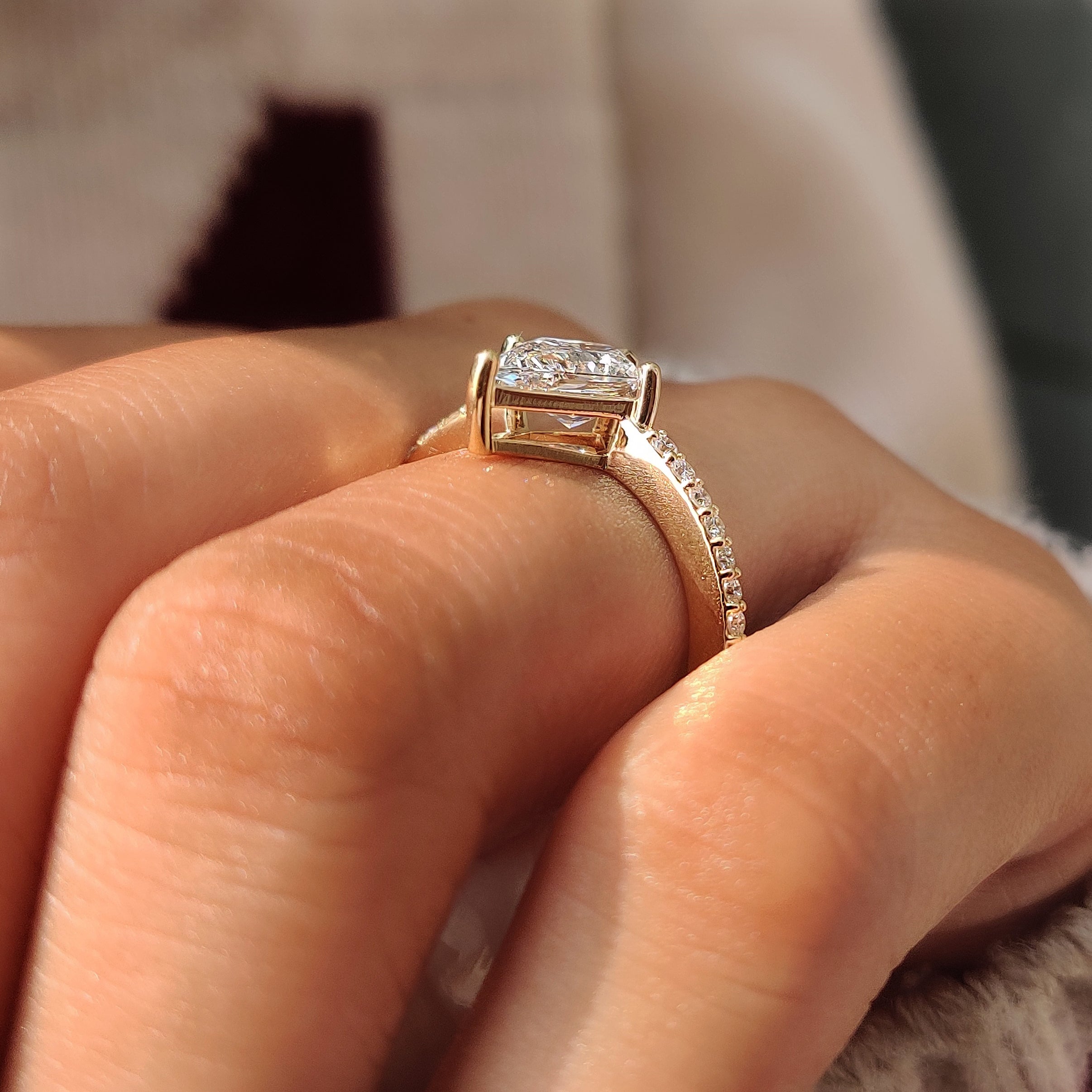 Yellow gold band with small round pave diamonds.
