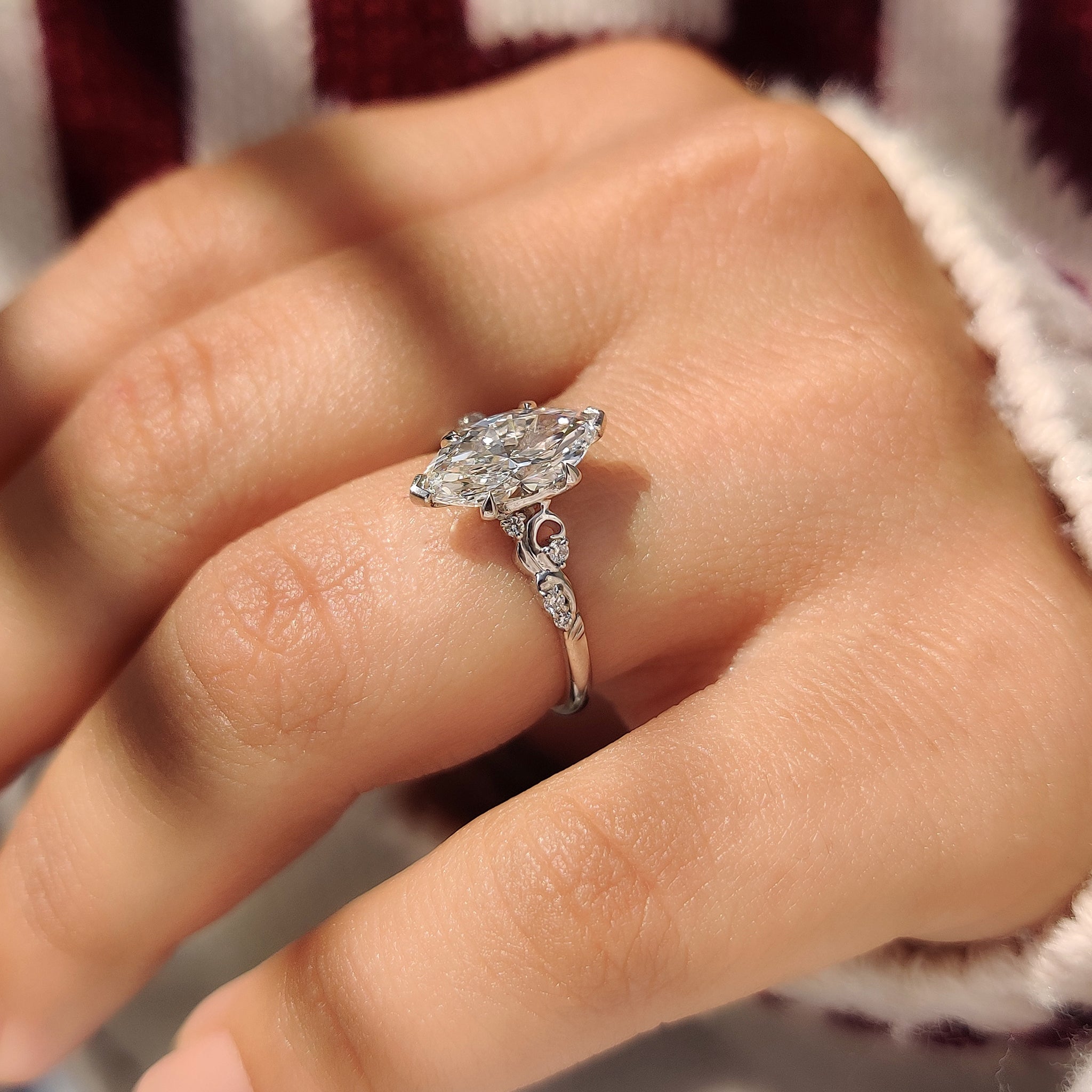 Vintage style marquise diamond ring with tulip setting details
