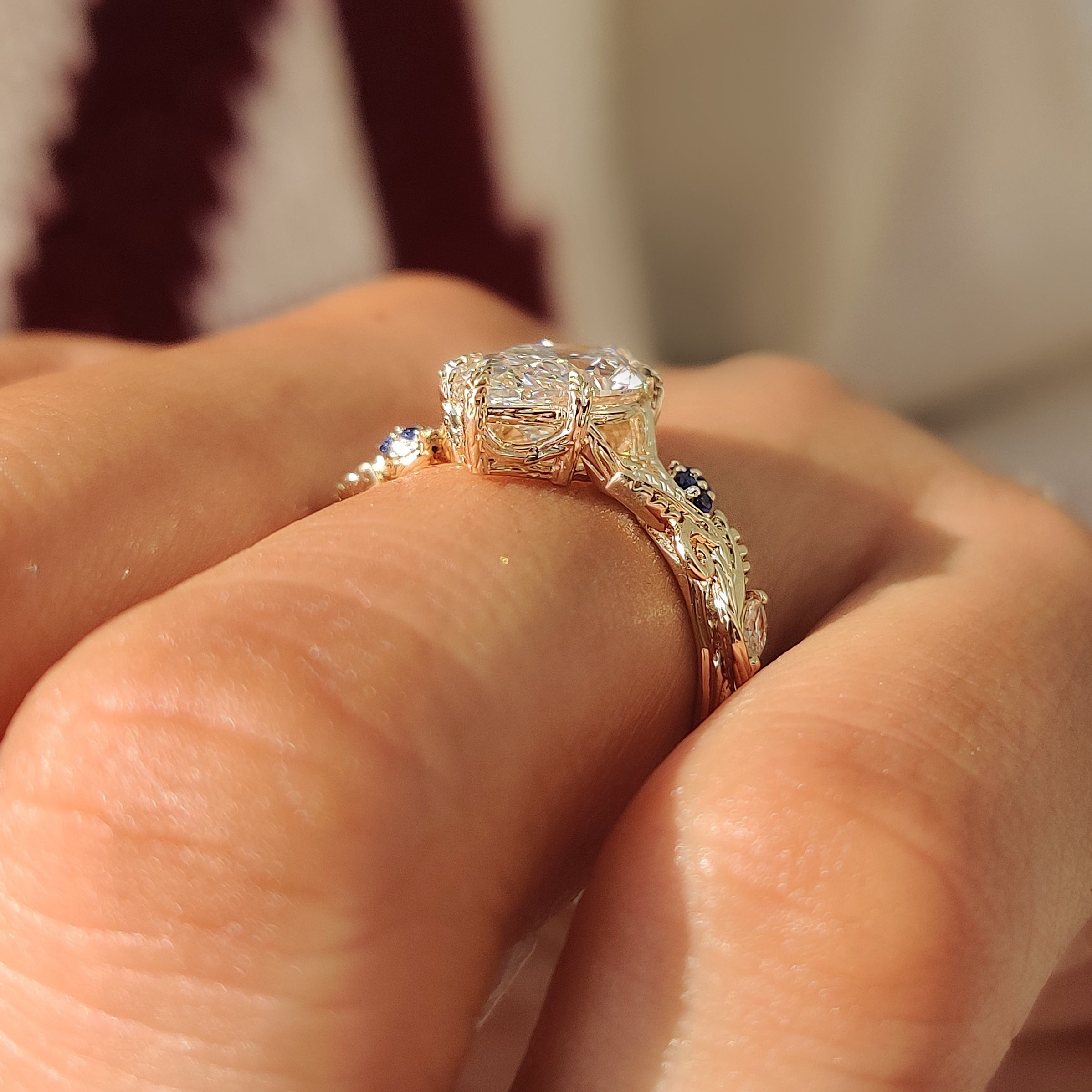 Blue sapphire round diamond set beside marquise diamond.
