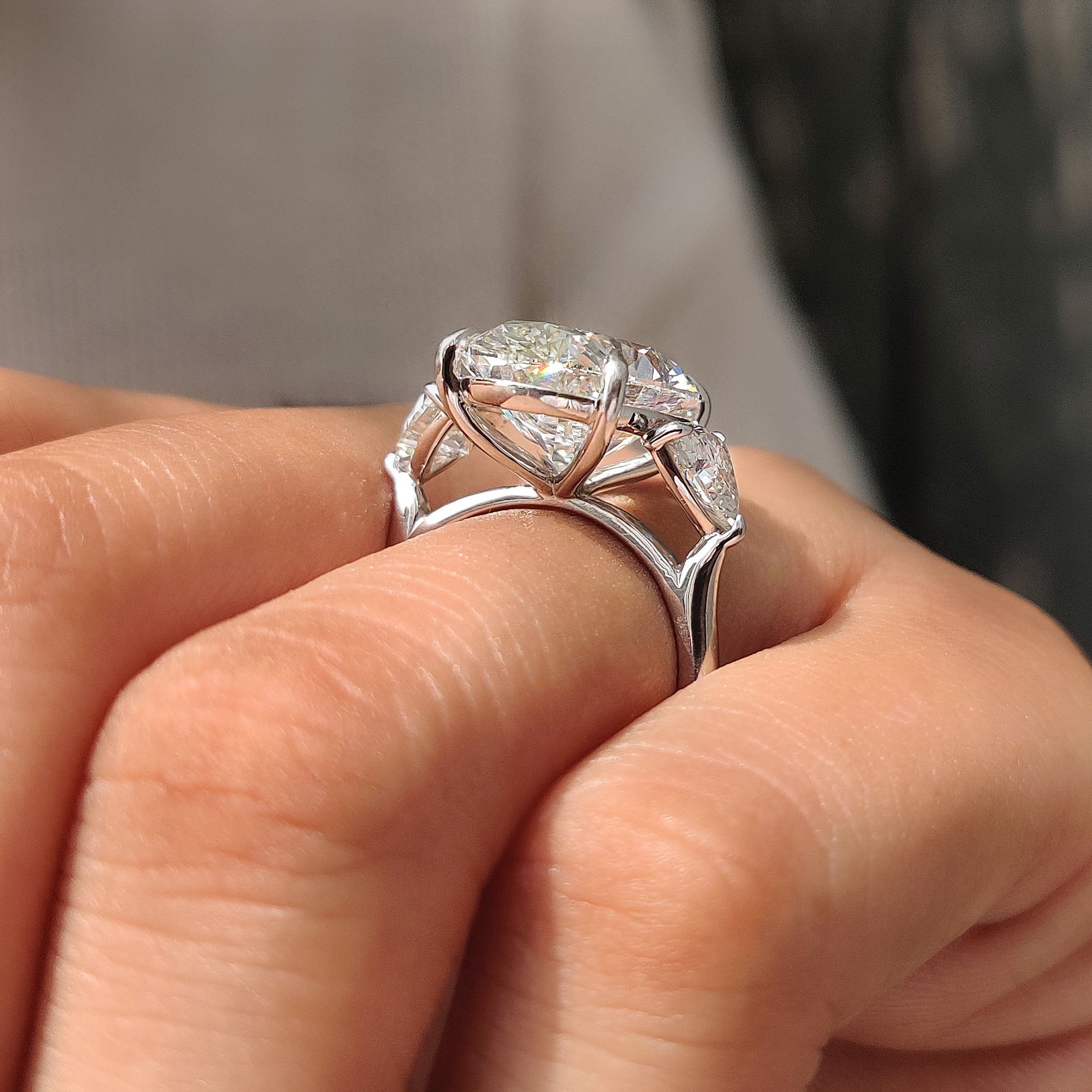 Carat Diamonds oval diamond ring with side stones

