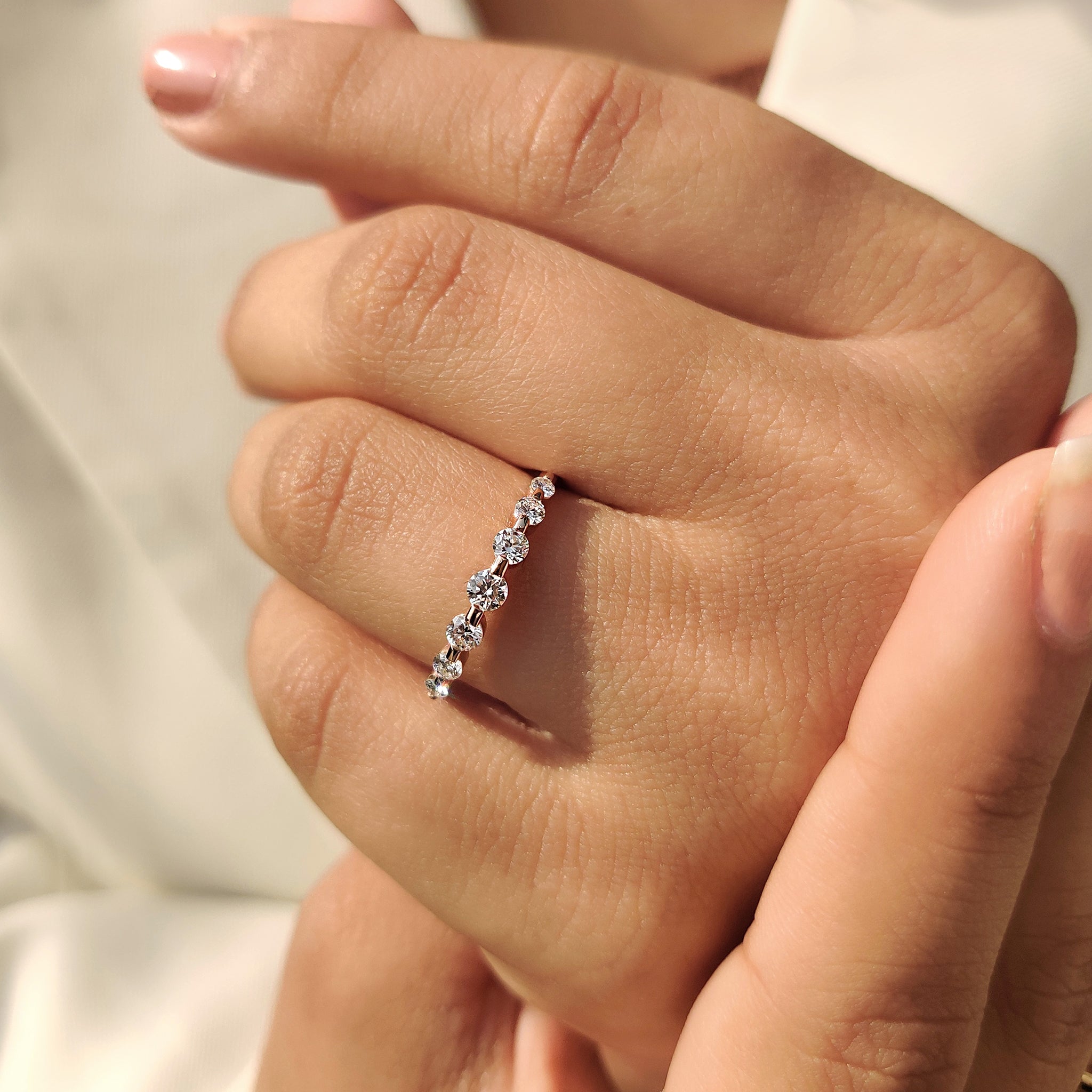 Round lab diamond band with half eternity design setting.
