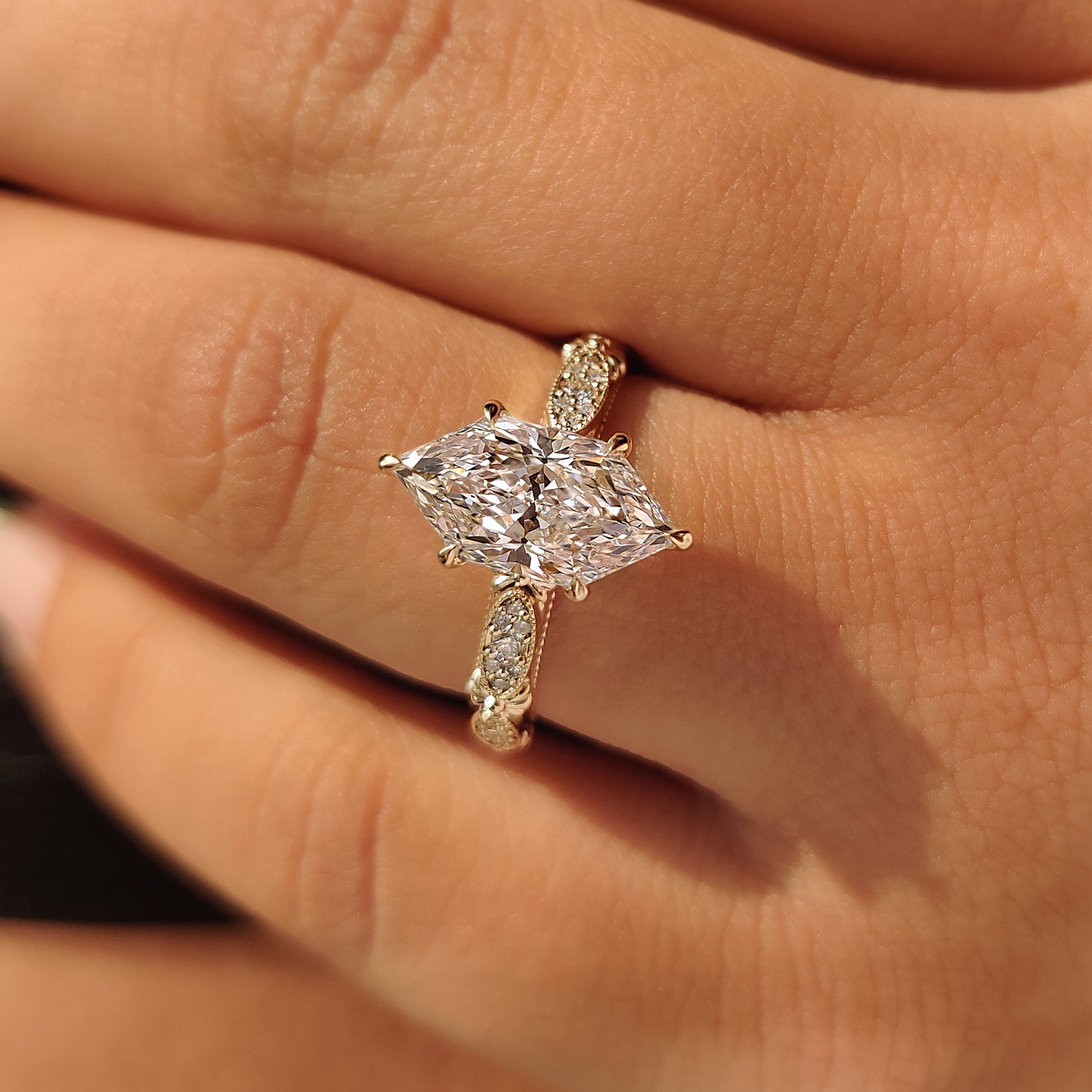 Dutch marquise engagement ring with floral band engraving.
