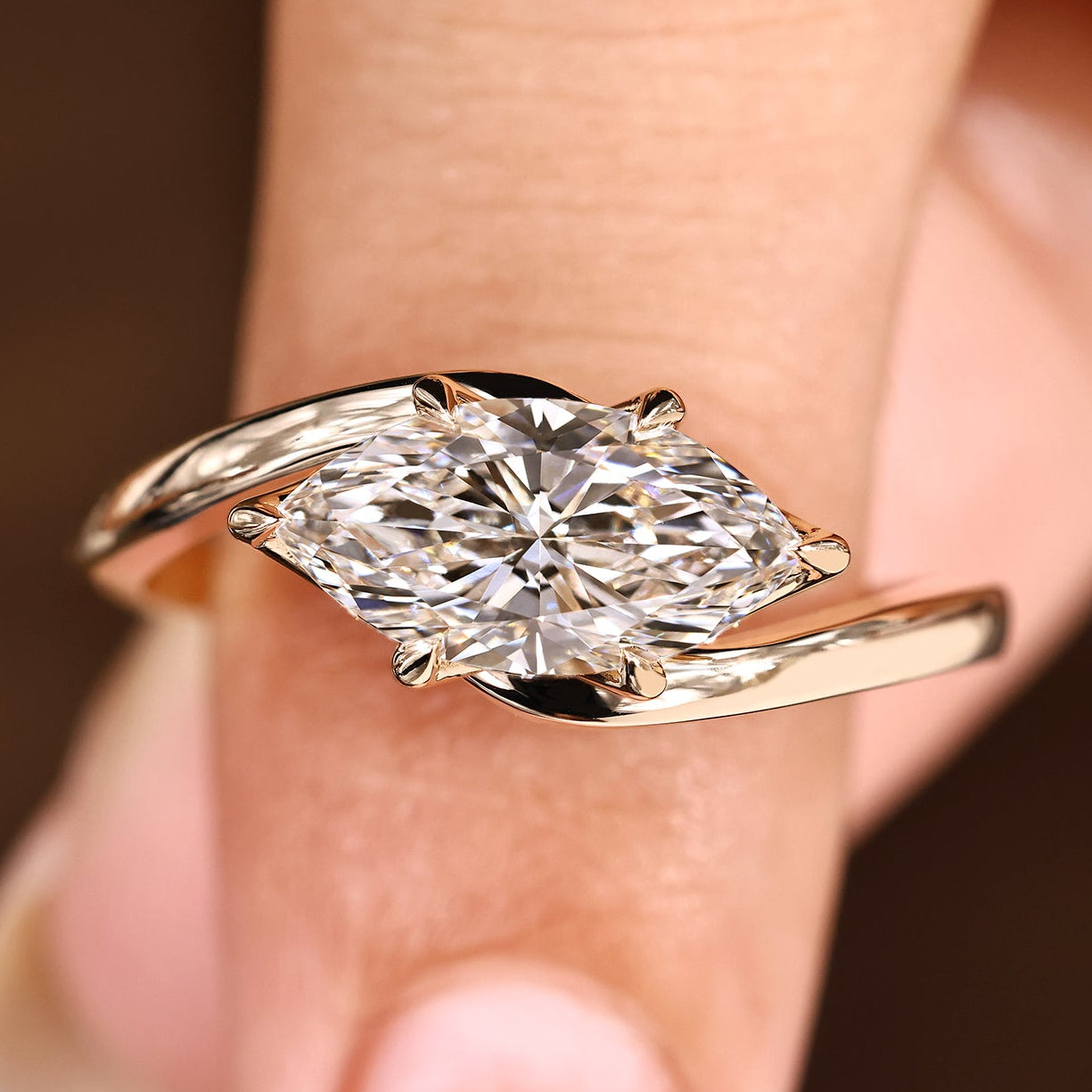Marquise engagement ring with east to west setting style
