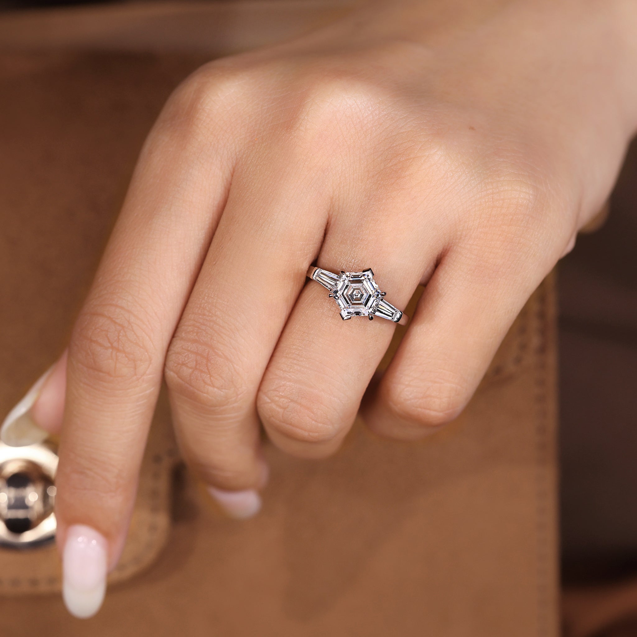 Handmade three stone ring with V shaped prong setting.
