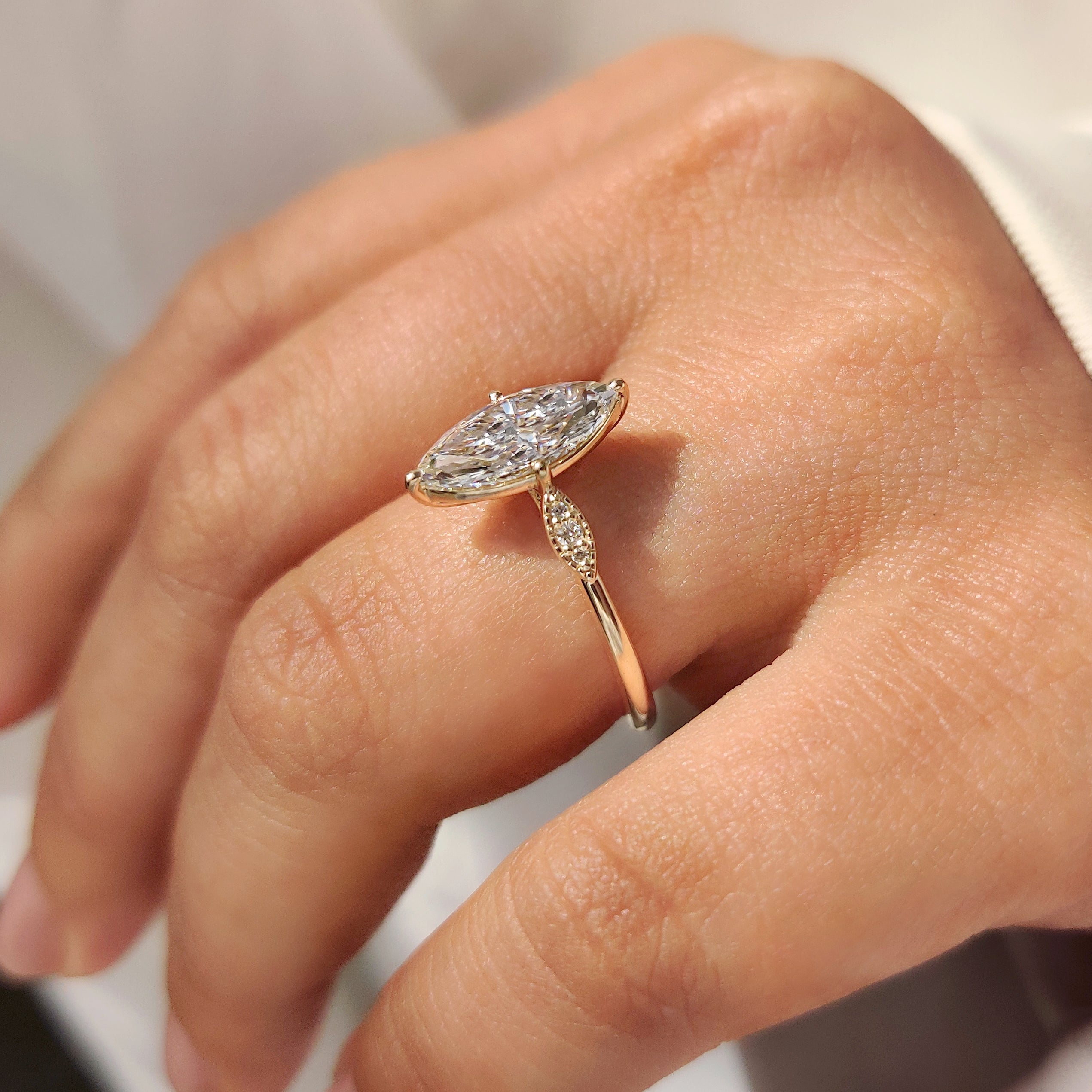 Handmade marquise diamond ring with detailed milgrain edge.
