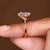Pear cut diamond ring with round and marquise details

