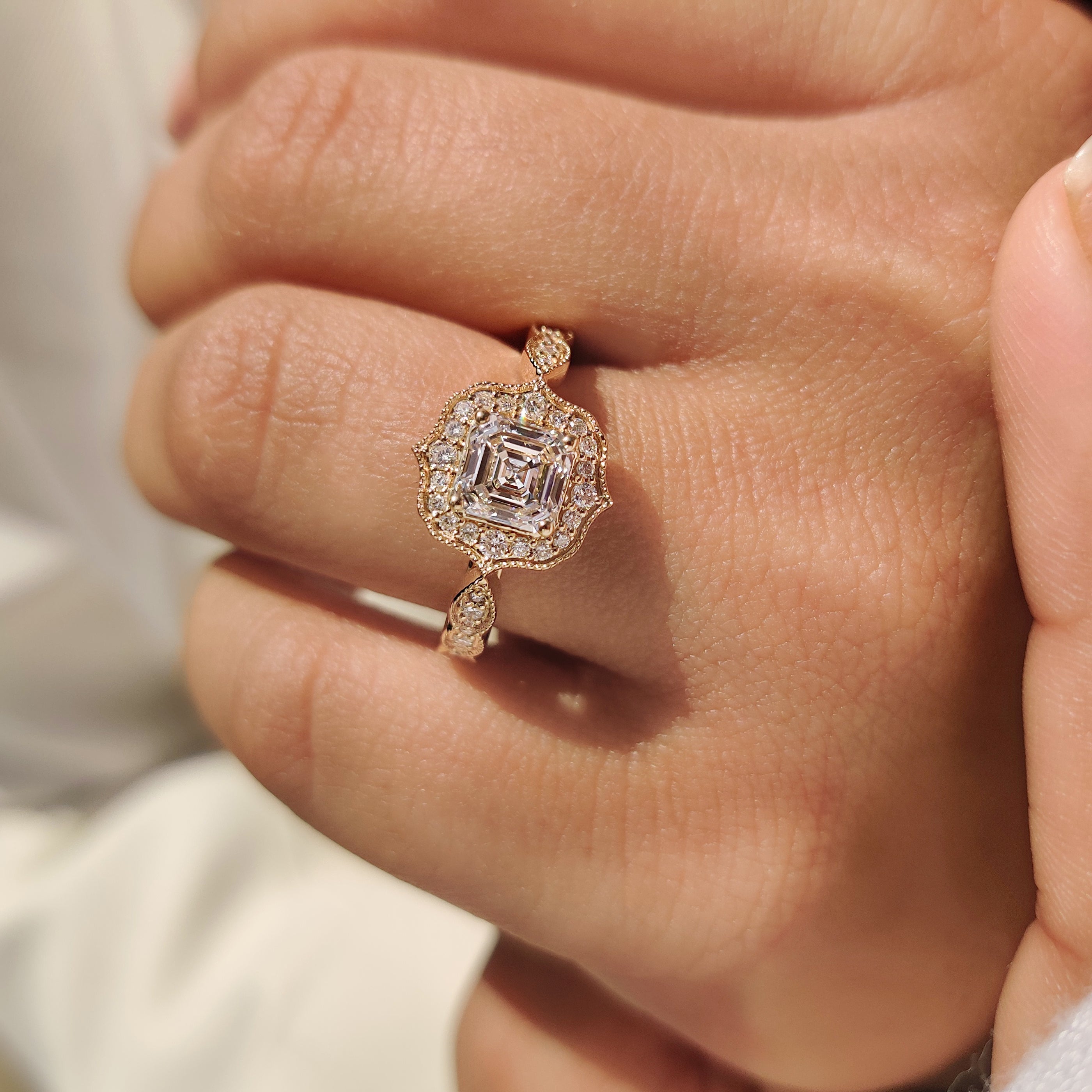 Handmade Asscher cut diamond ring with vintage style.
