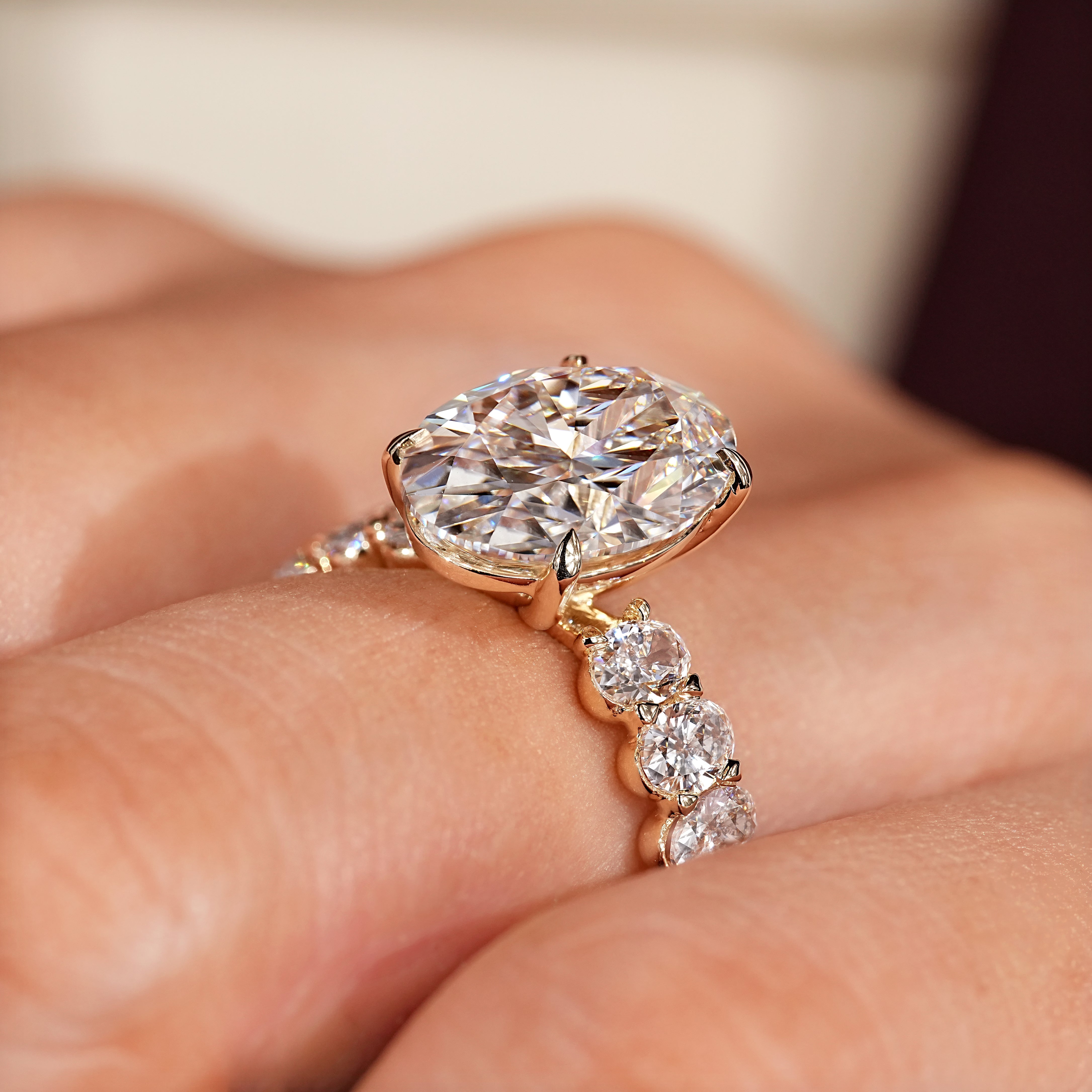 Oval ring with four claw prong setting
