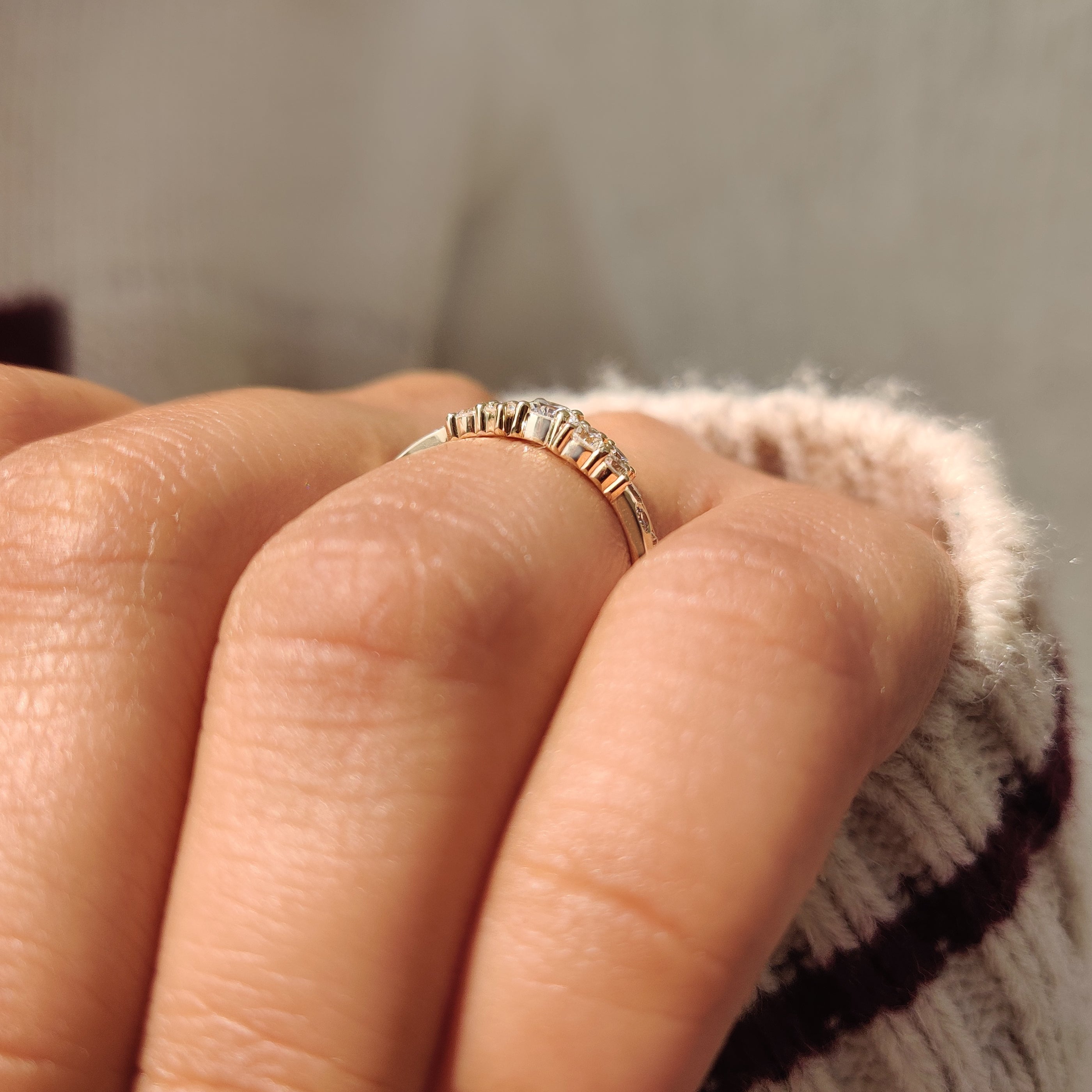 Handmade round diamond band with scattered diamond design.

