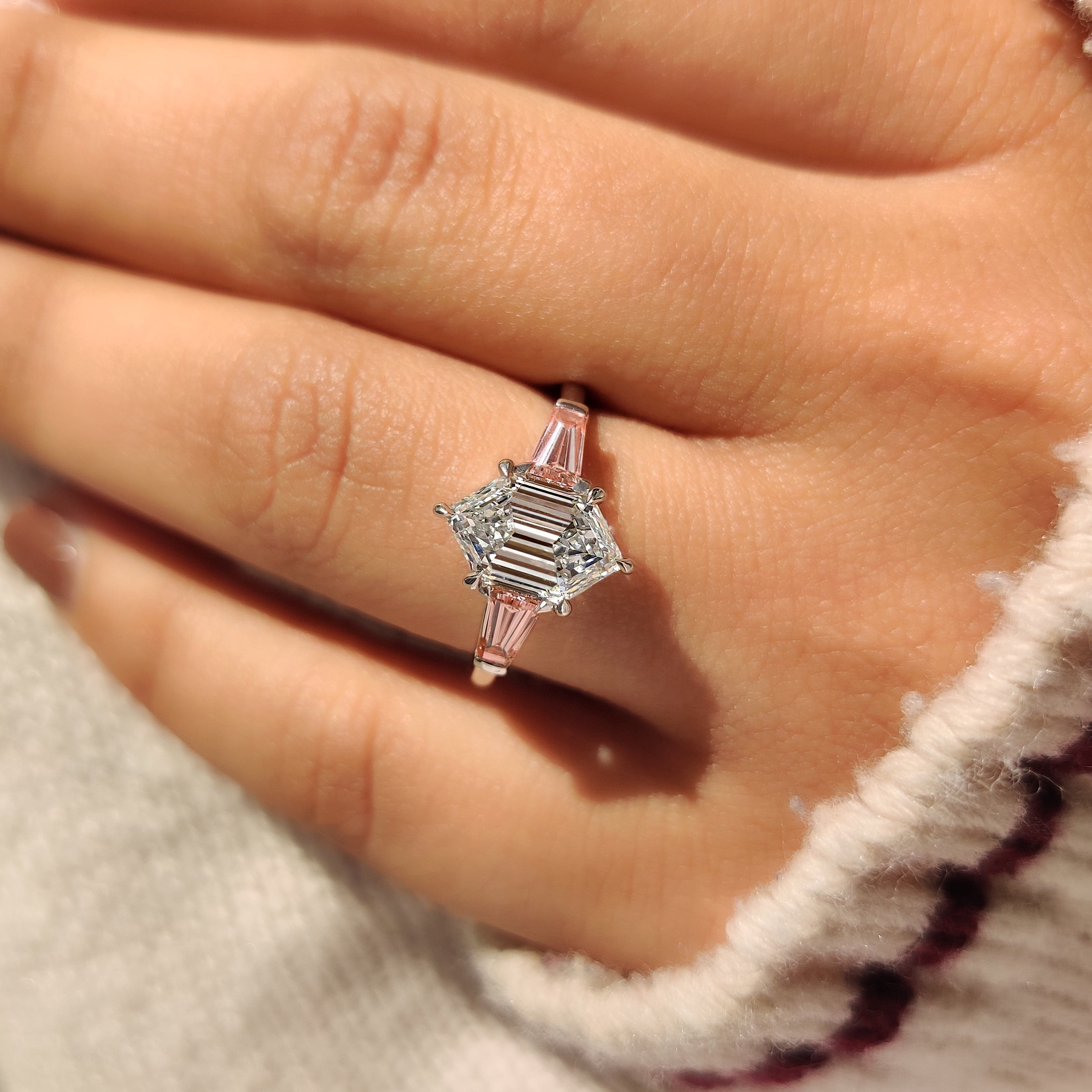 Six claw prong hexagon diamond ring with baguette sides
