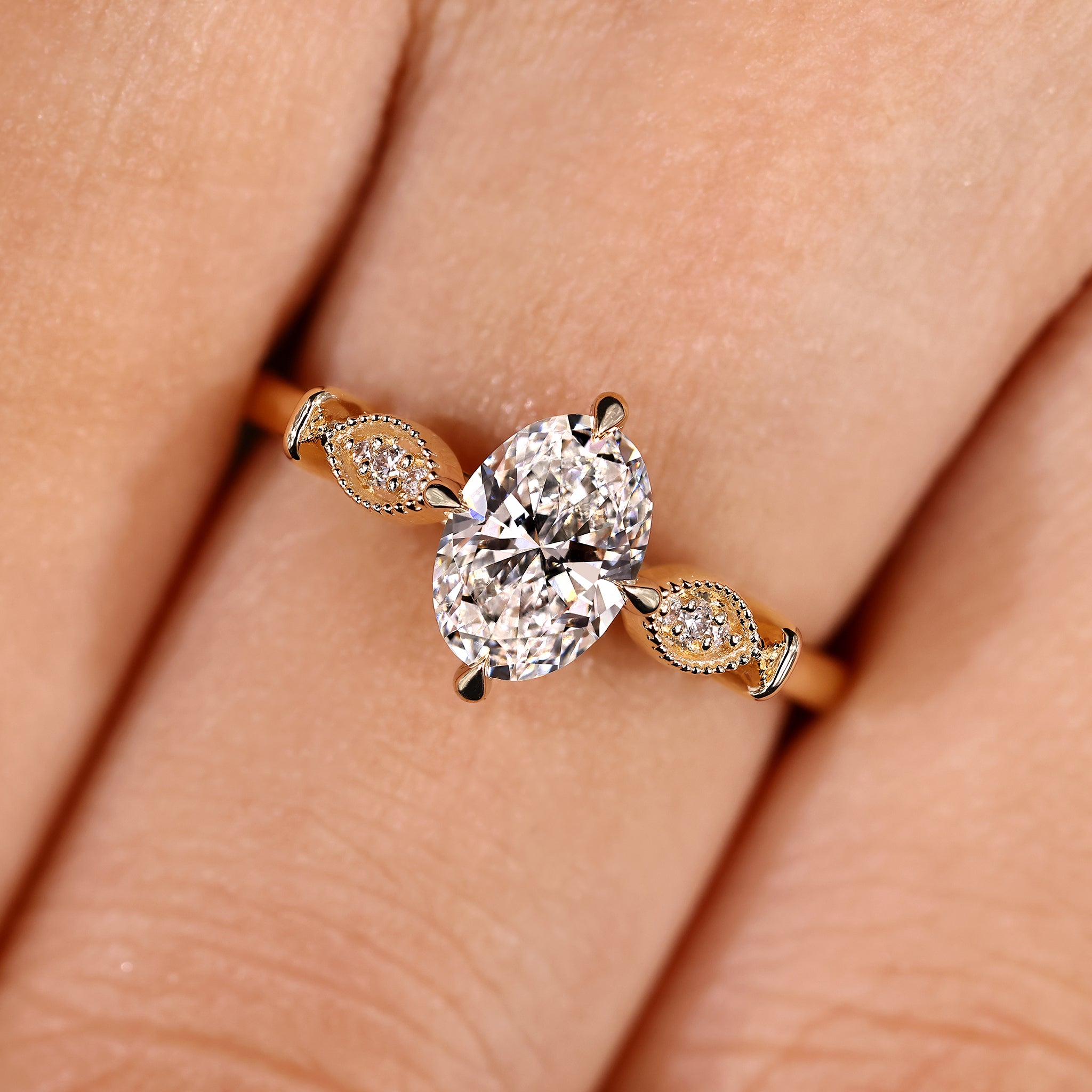 Oval cut diamond ring with vintage style milgrain edges
