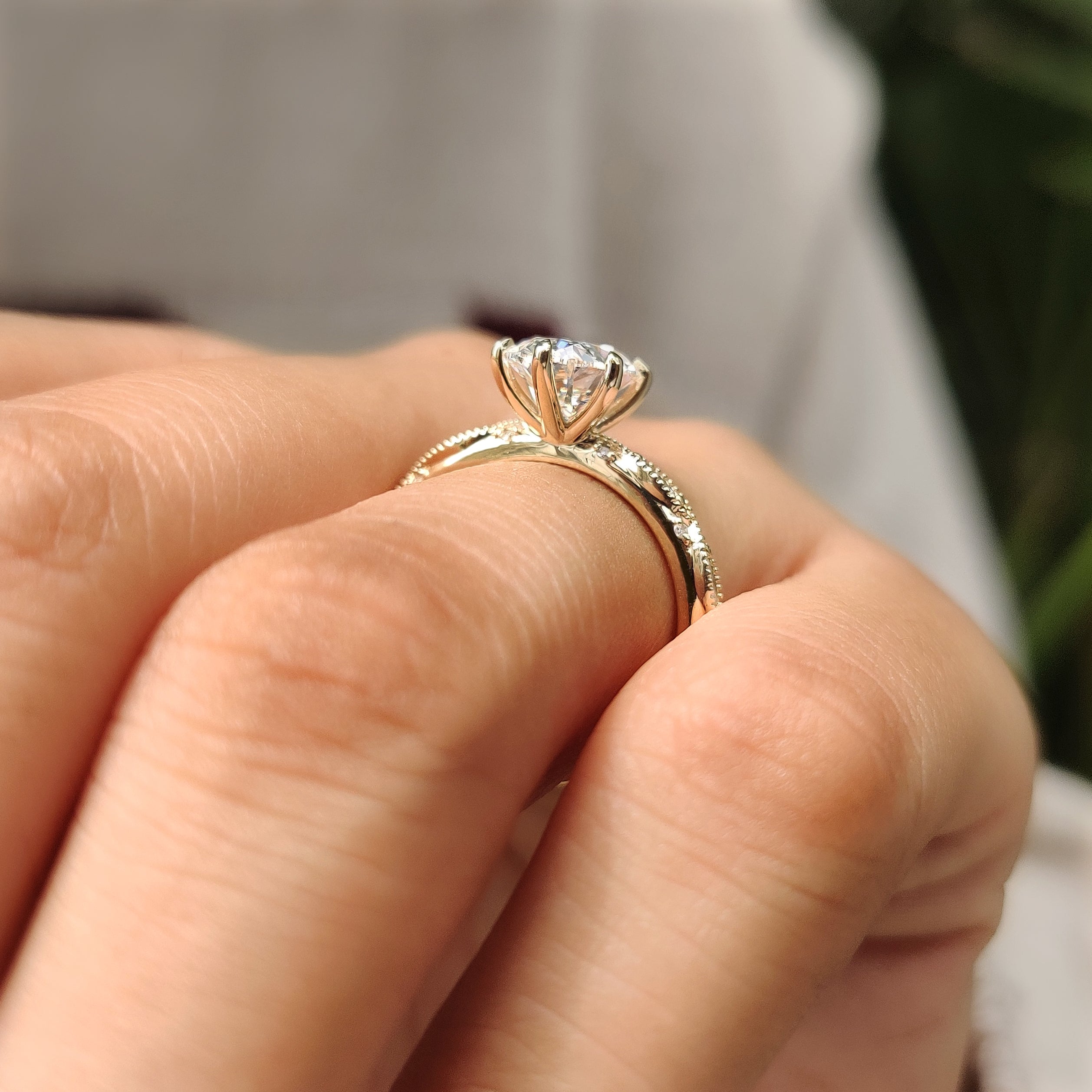 Vintage inspired ring with oval diamond and milgrain details

