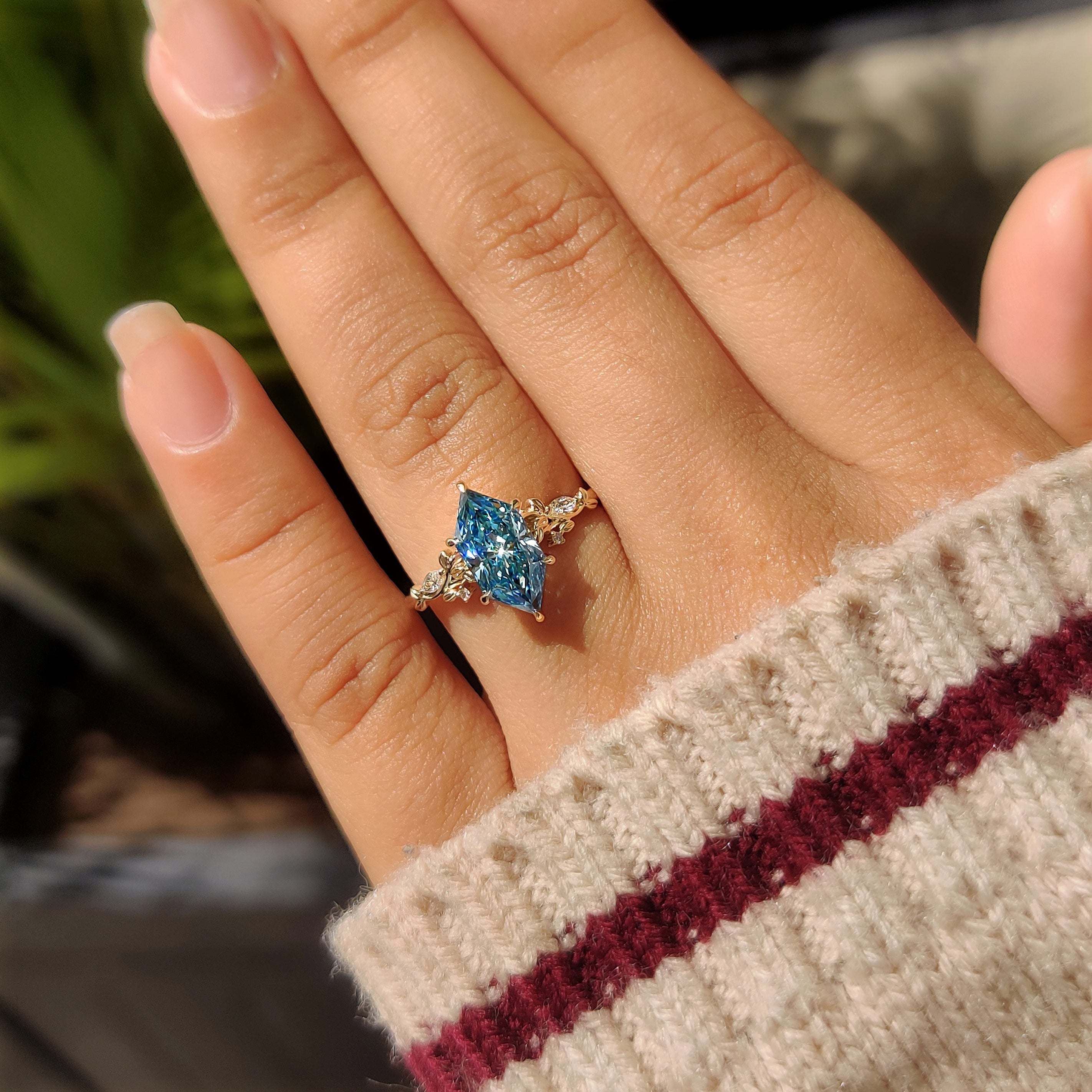 Marquise center diamond ring with nature inspired design
