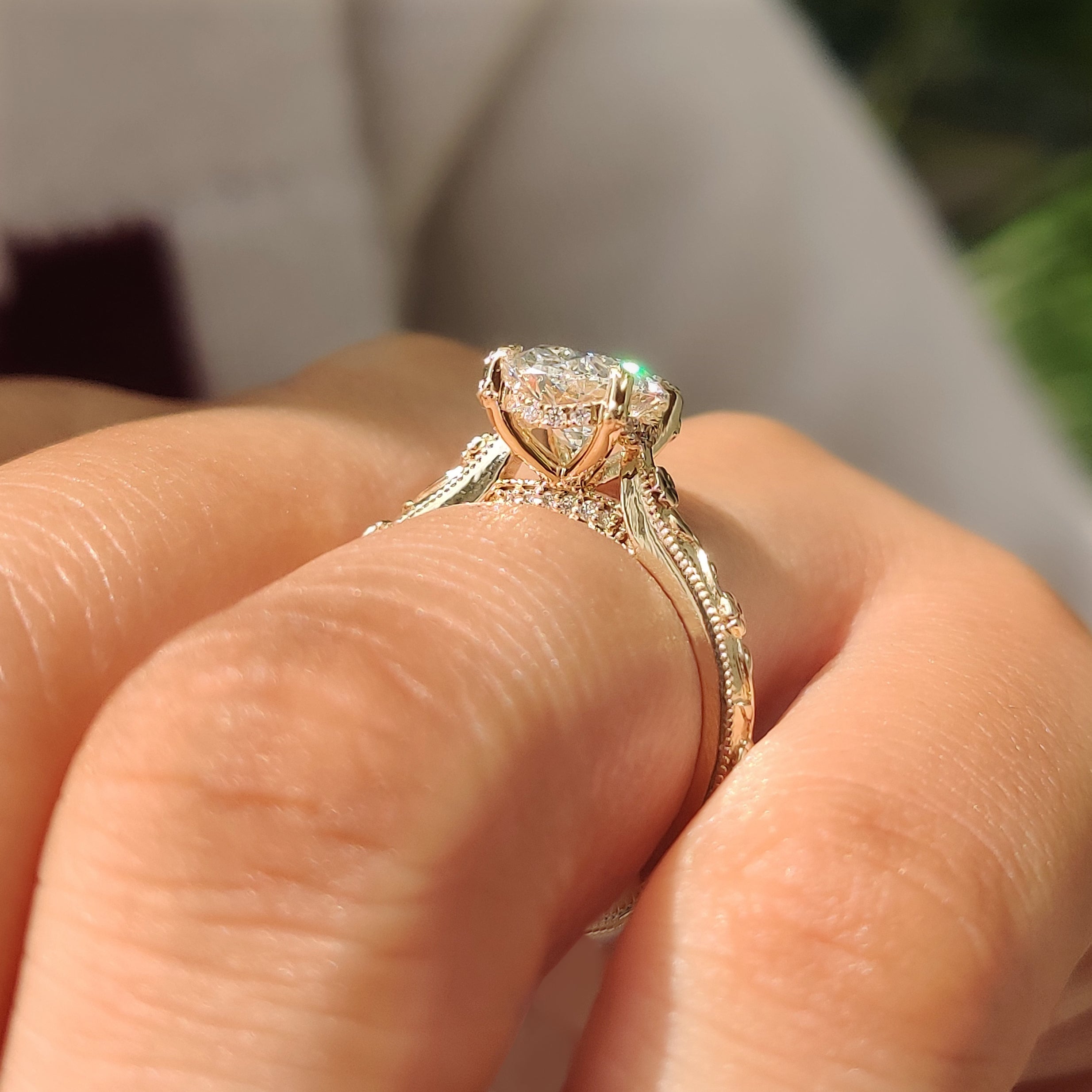 Handmade oval hidden halo solitaire engagement ring by Carat Diamonds.

