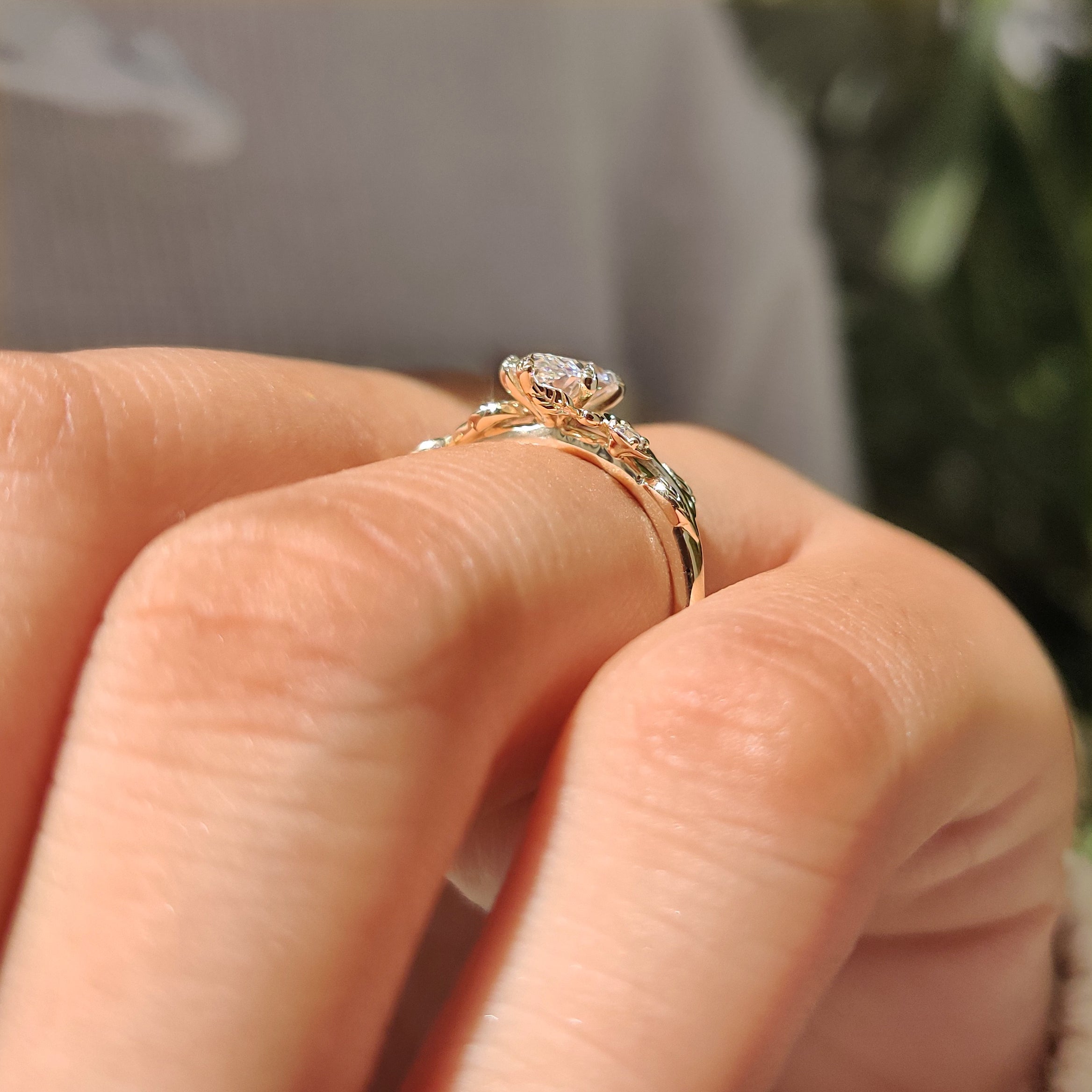 Marquise cut engagement ring with flower inspired side stones
