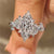 Marquise cut lab grown diamond ring with floral details.
