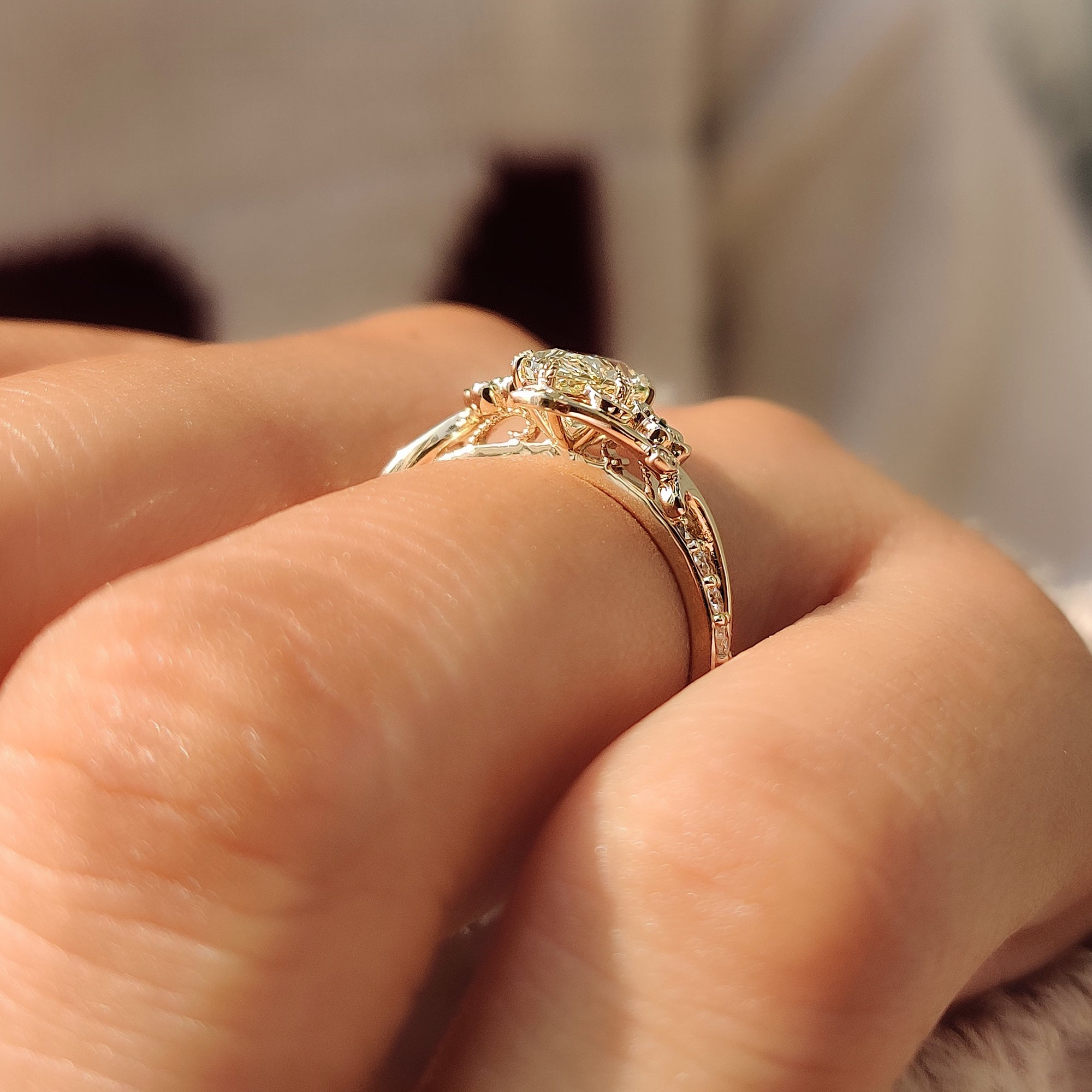 Nature inspired engagement ring with leaf and flower design.
