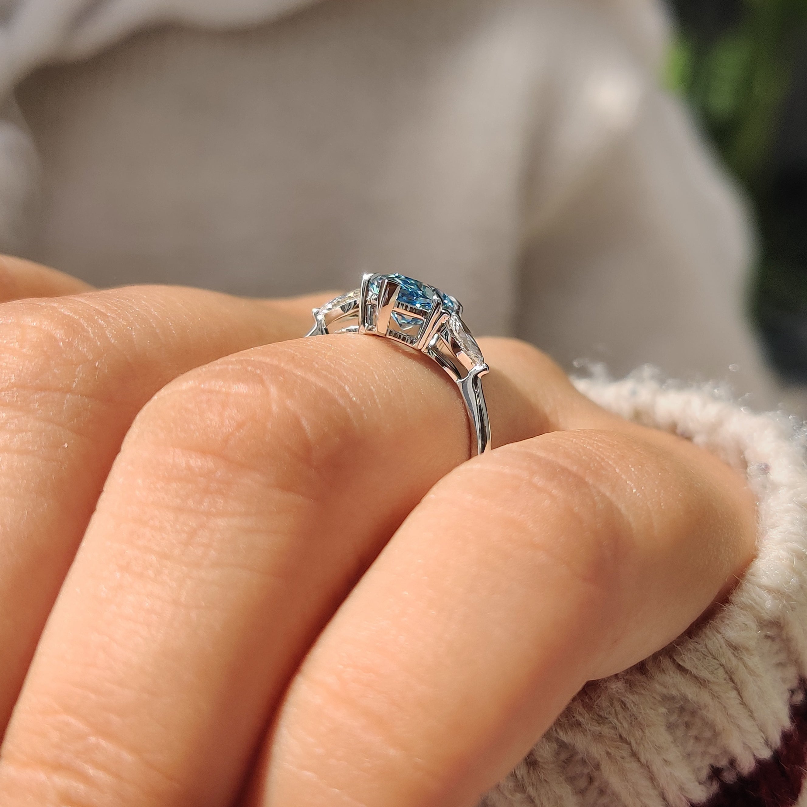 Pear side stones and V shape prong setting in handmade ring
