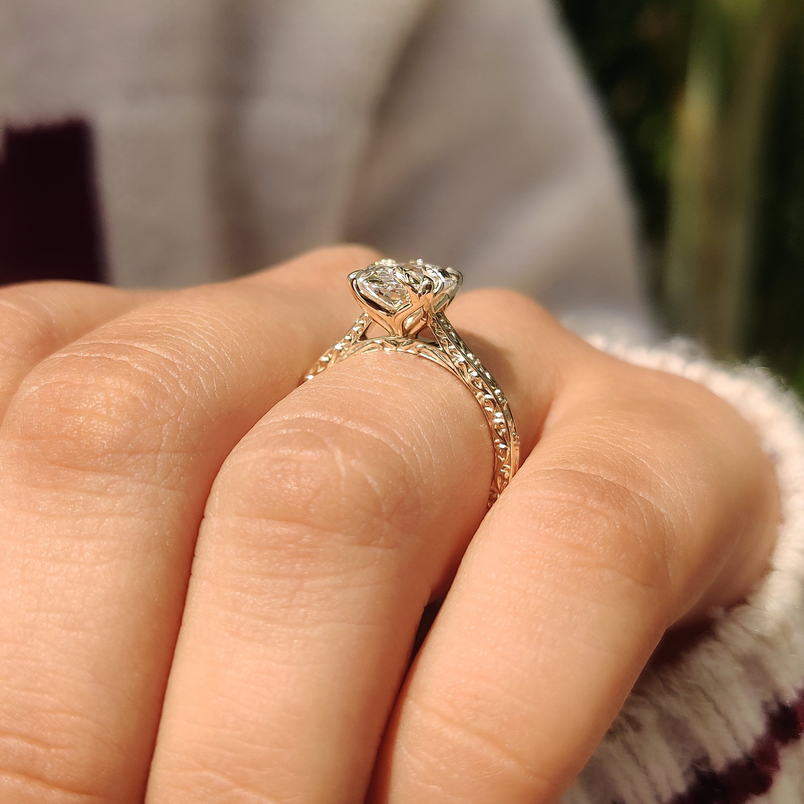Vintage style oval diamond ring with tulip setting design
