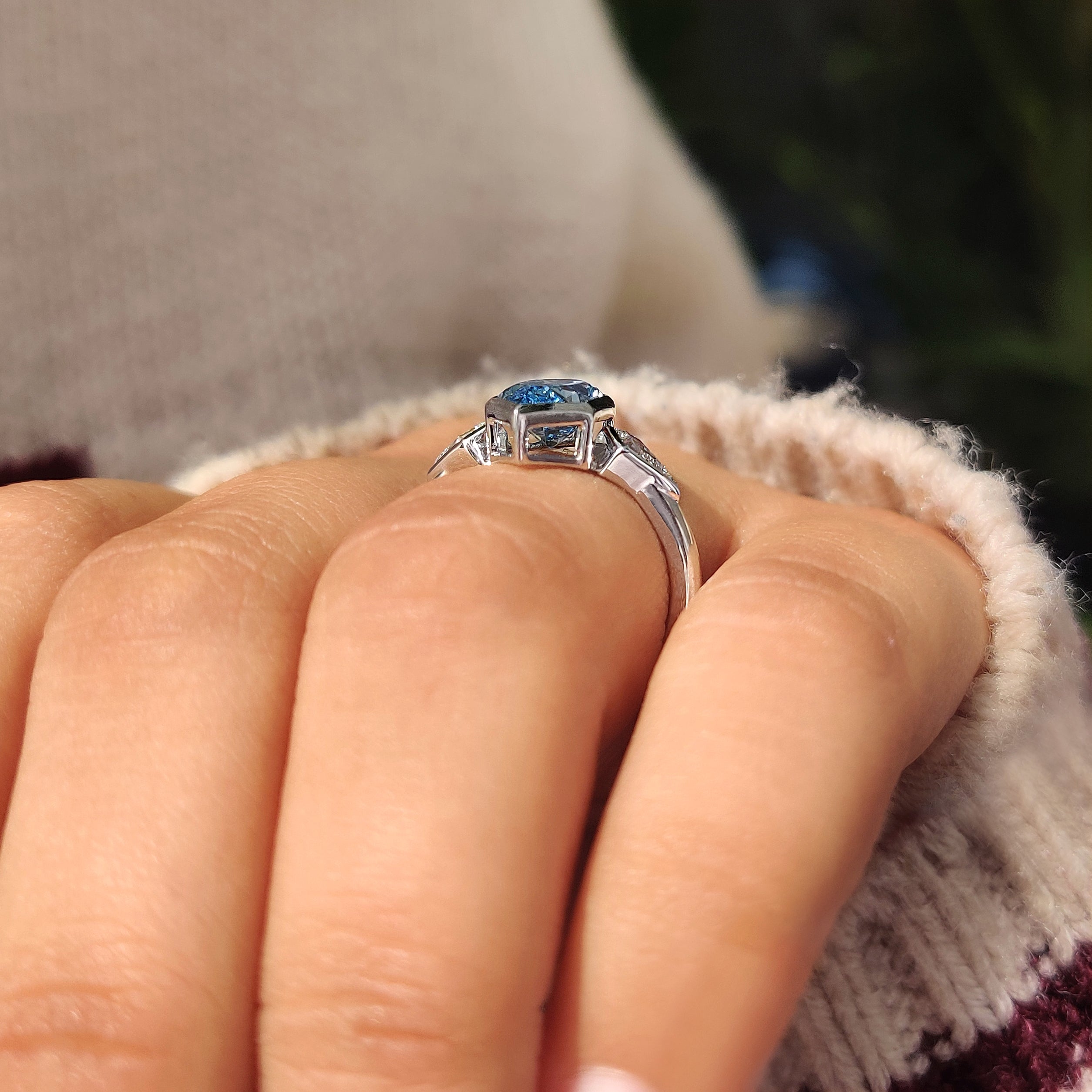 Three stone arrangement with blue dutch marquise center diamond
