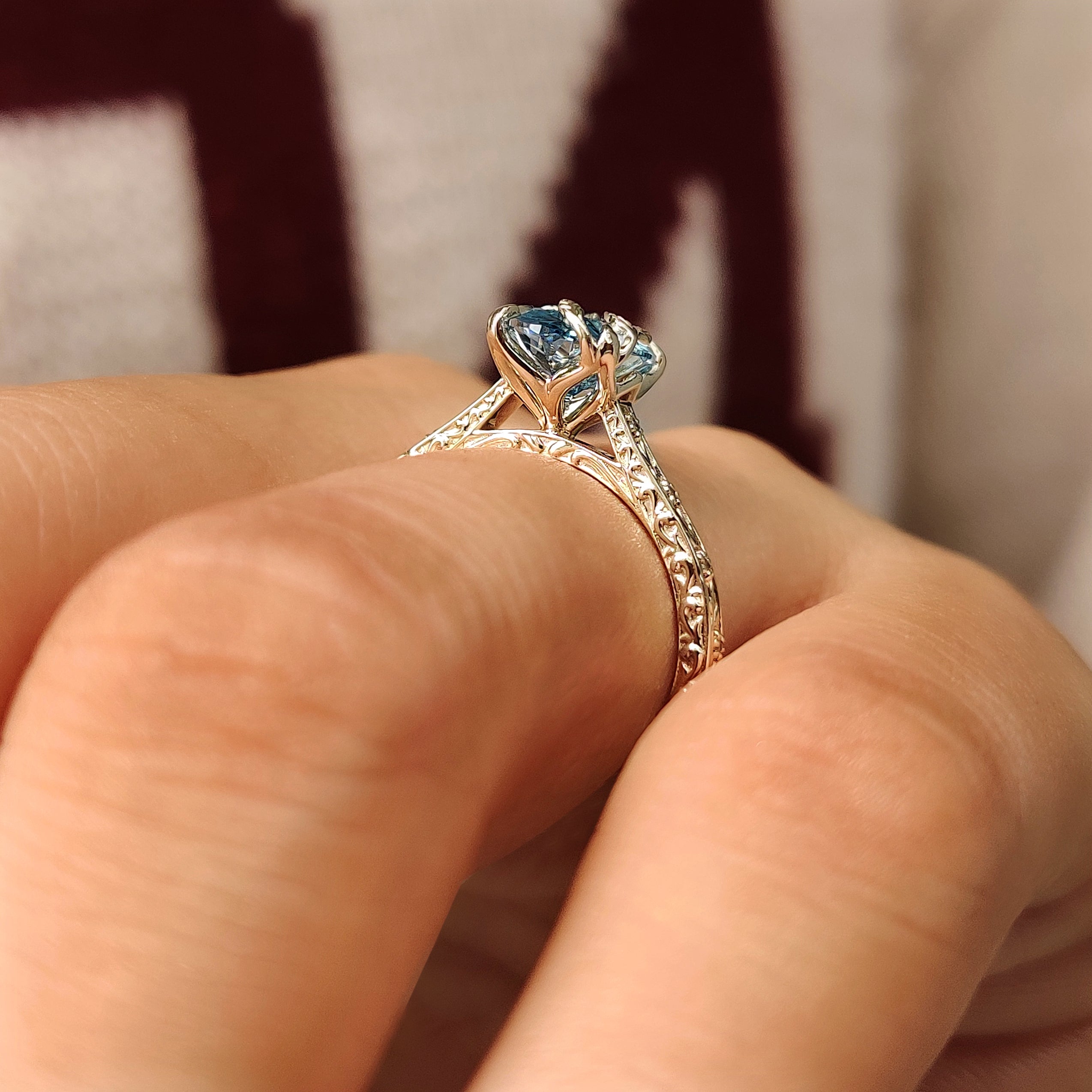 Claw prong oval diamond ring with floral design
