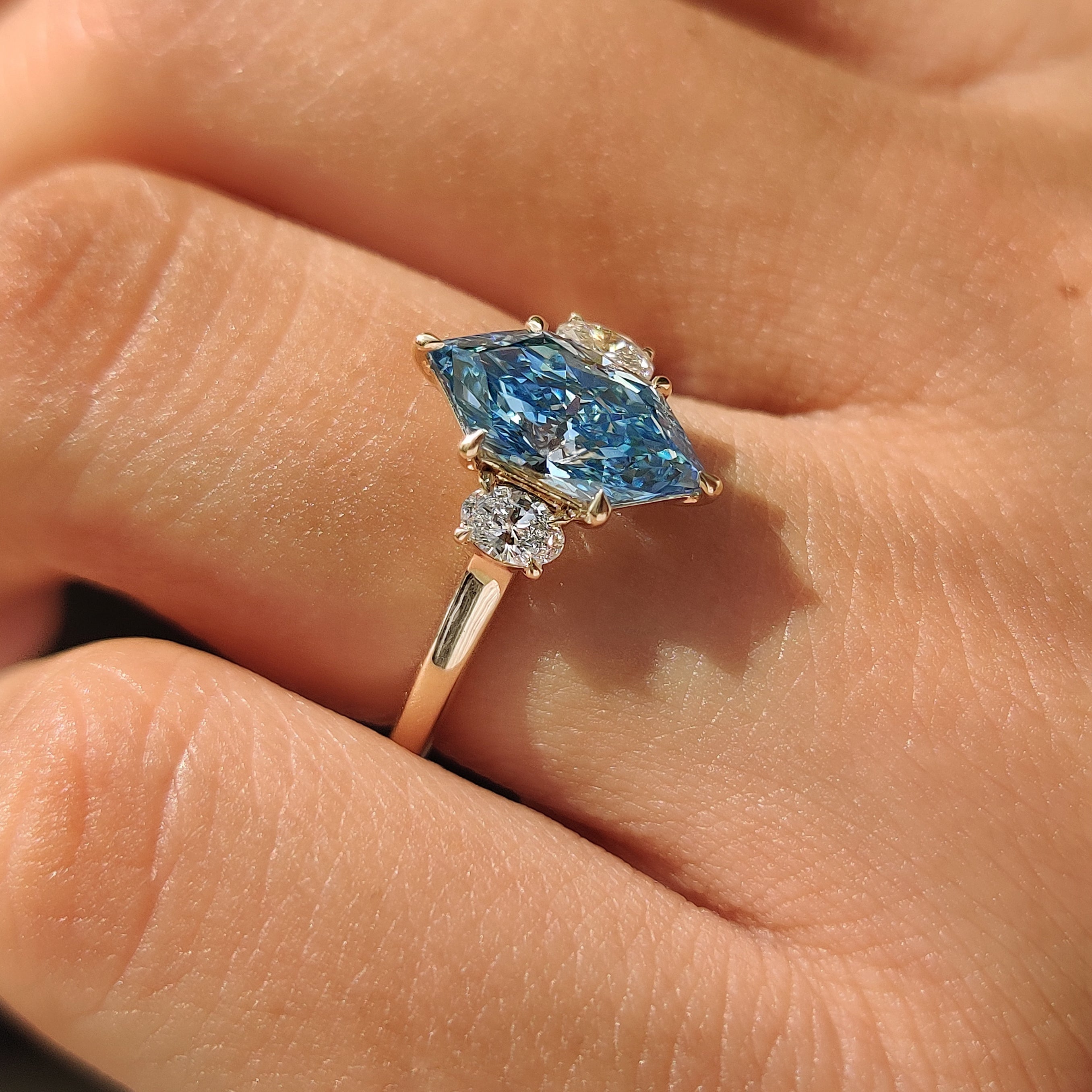 Blue Dutch marquise lab grown diamond ring in yellow gold.
