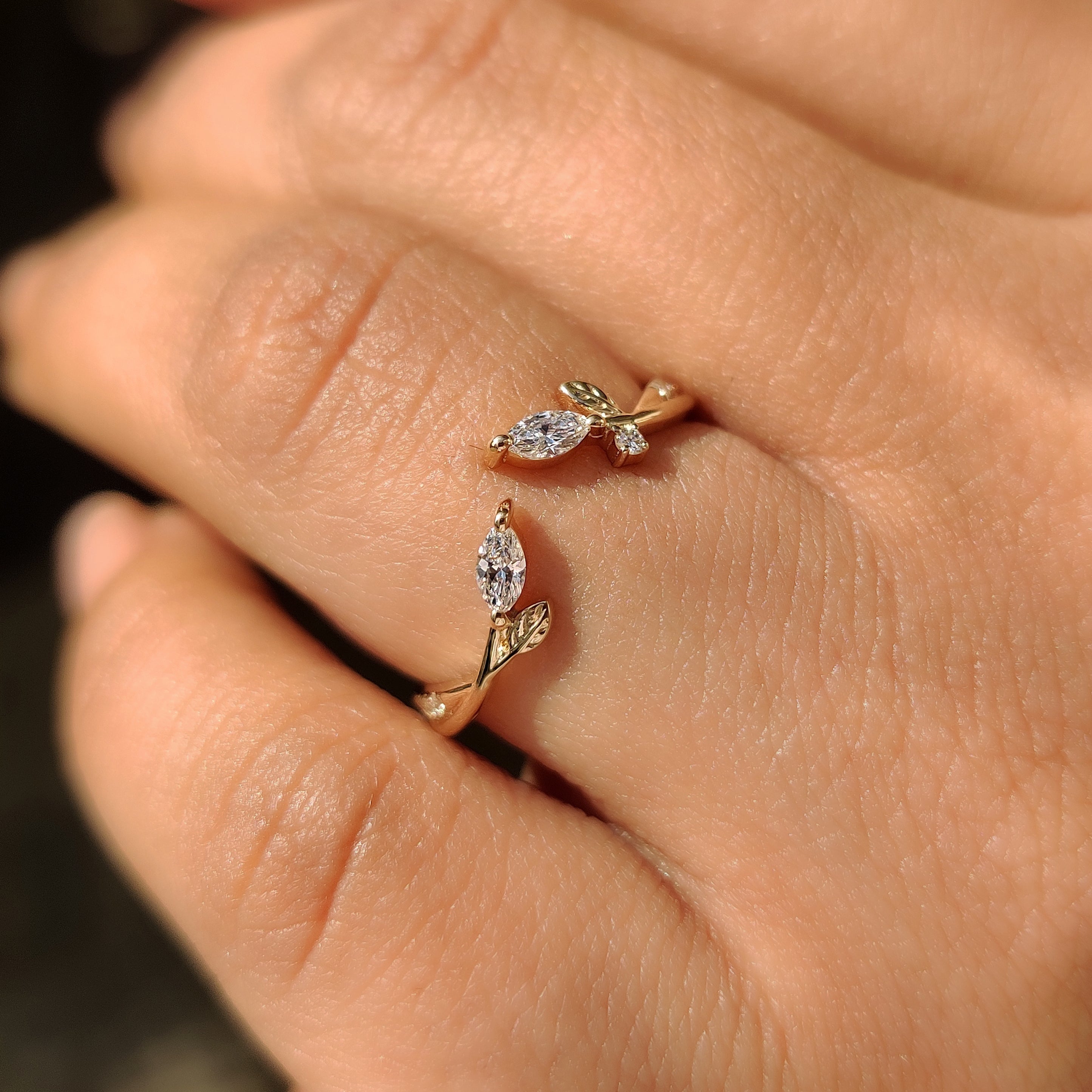 Nature inspired stackable ring with open gap setting style.
