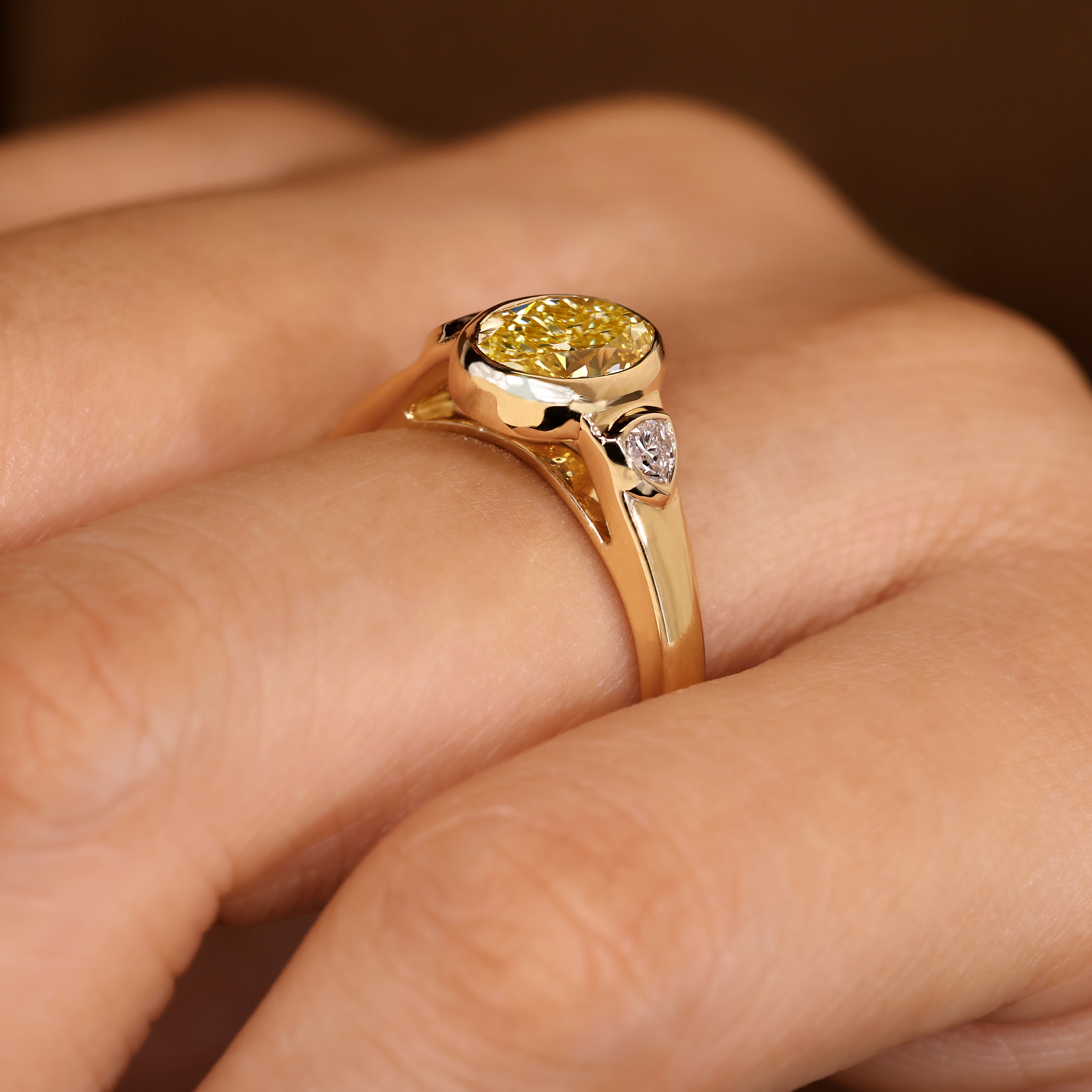 Oval lab diamond ring with three stone style setting
