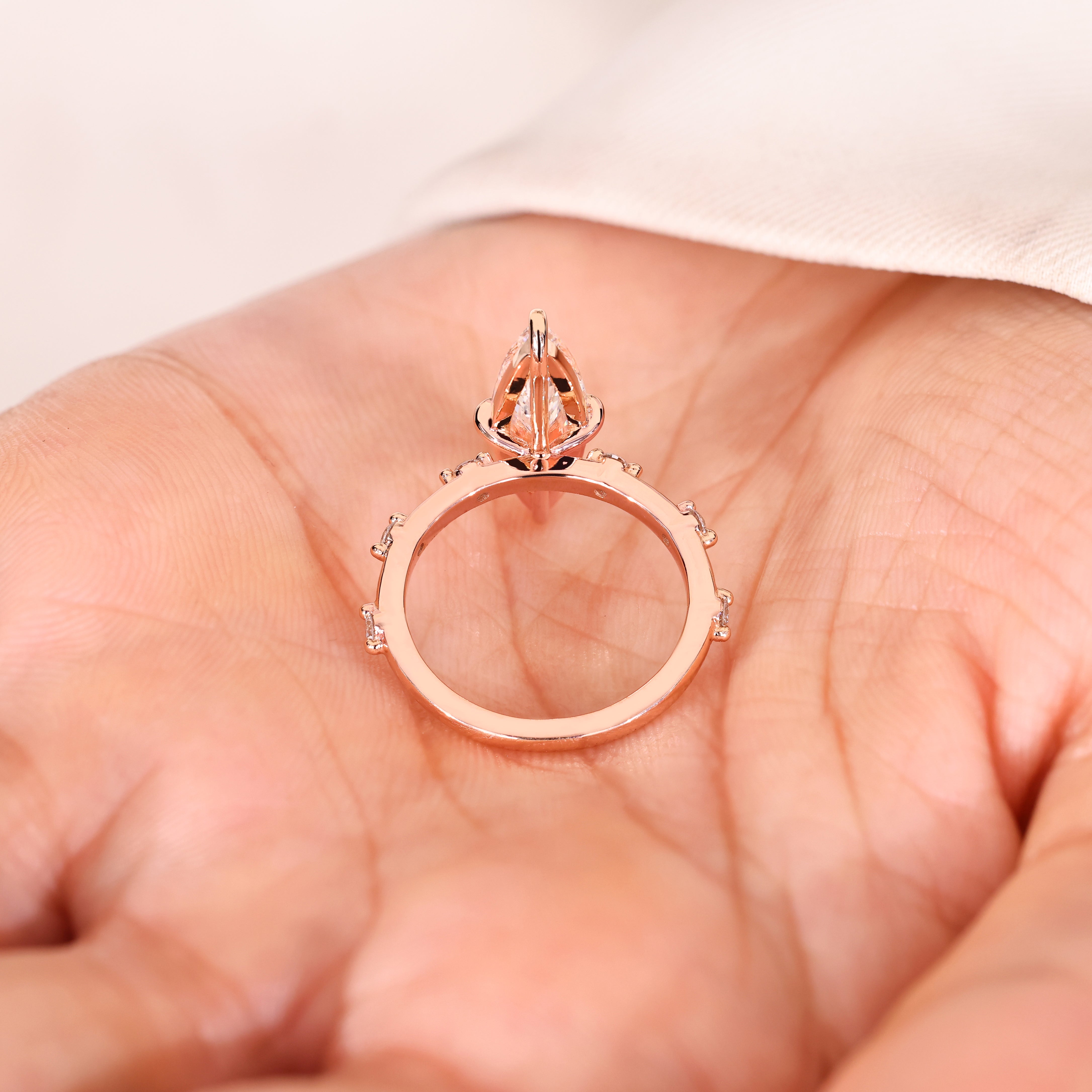 Elongated marquise diamond ring with secure claw prongs
