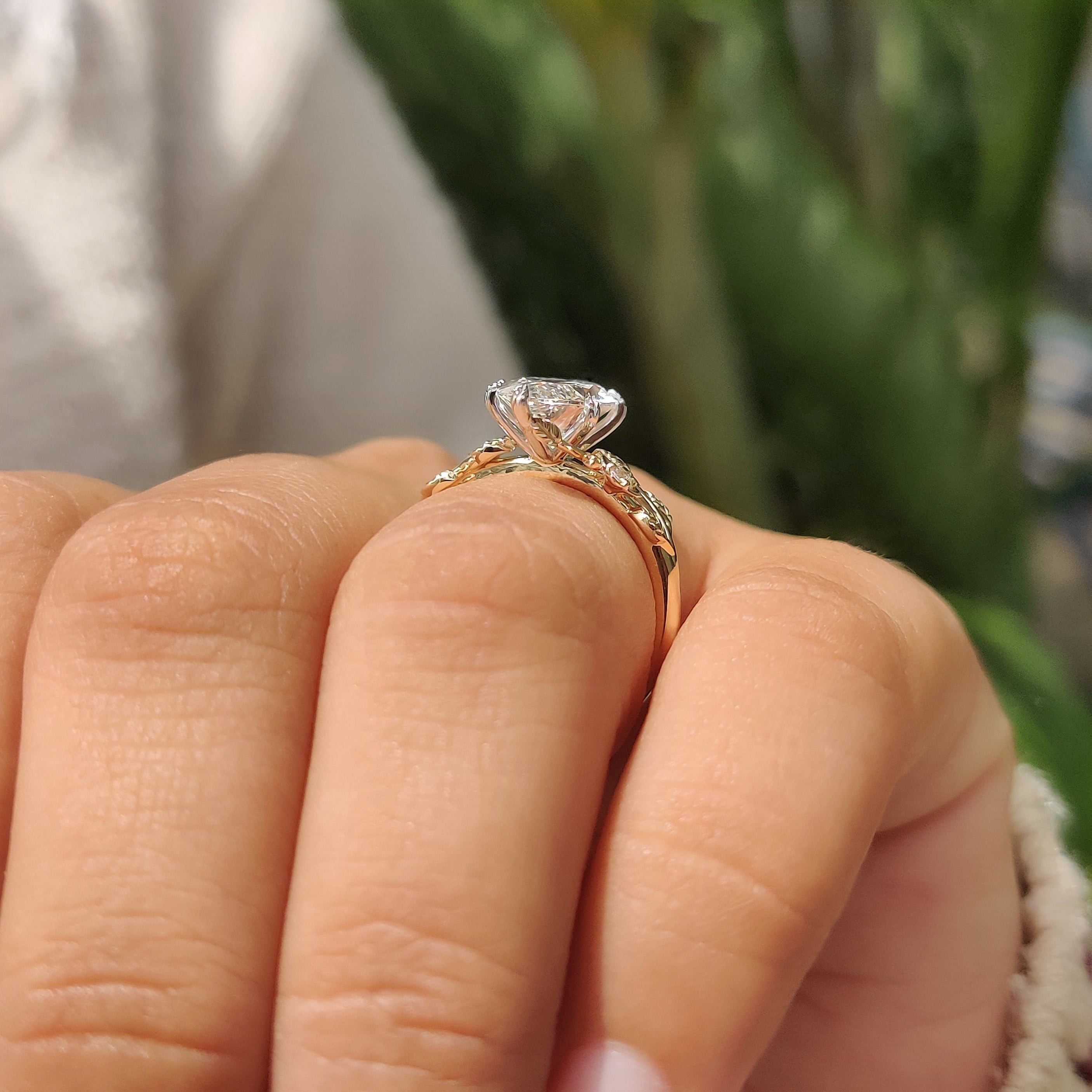 Leaf style shank with floral details on engagement ring
