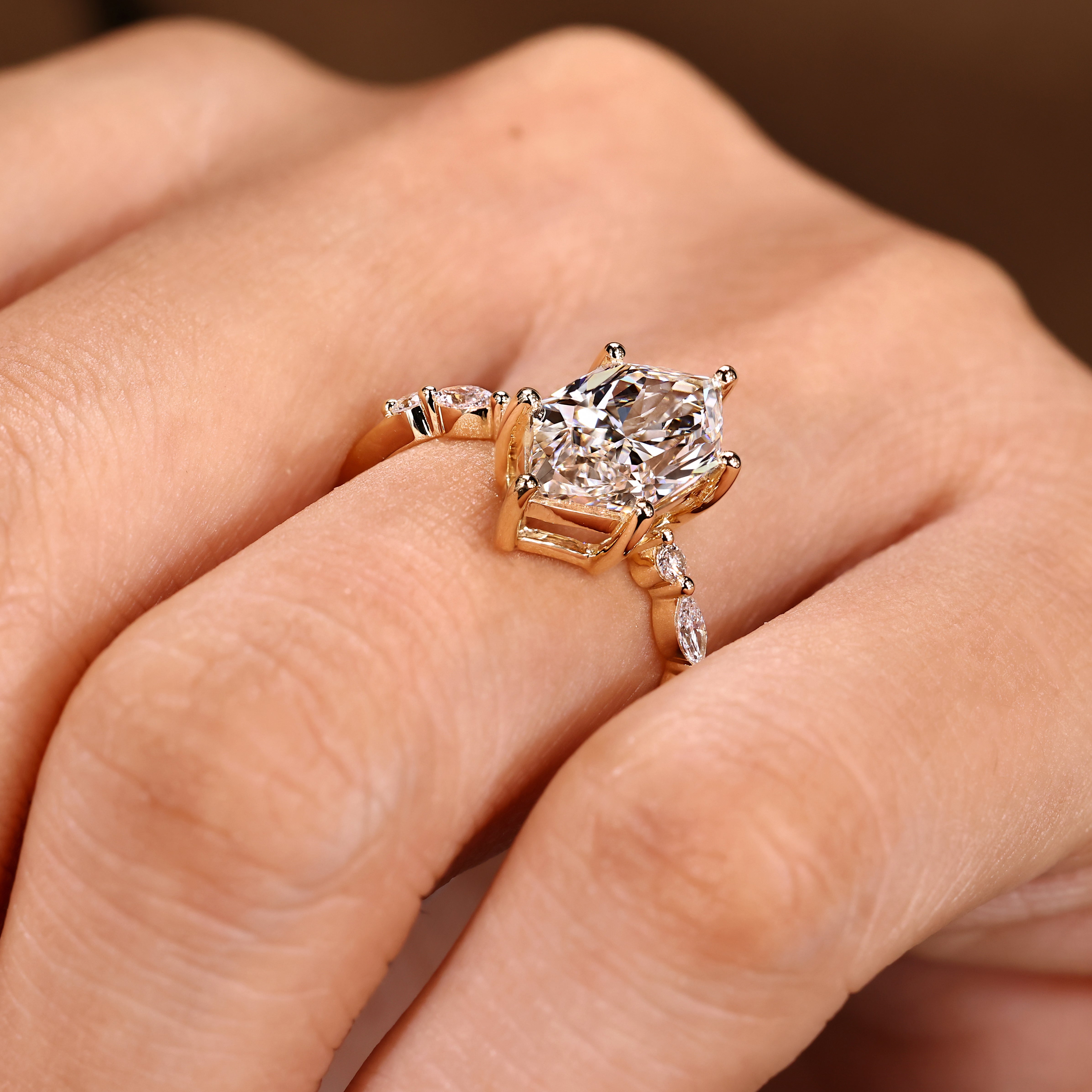 Marquise diamond ring with distance pave prong style setting
