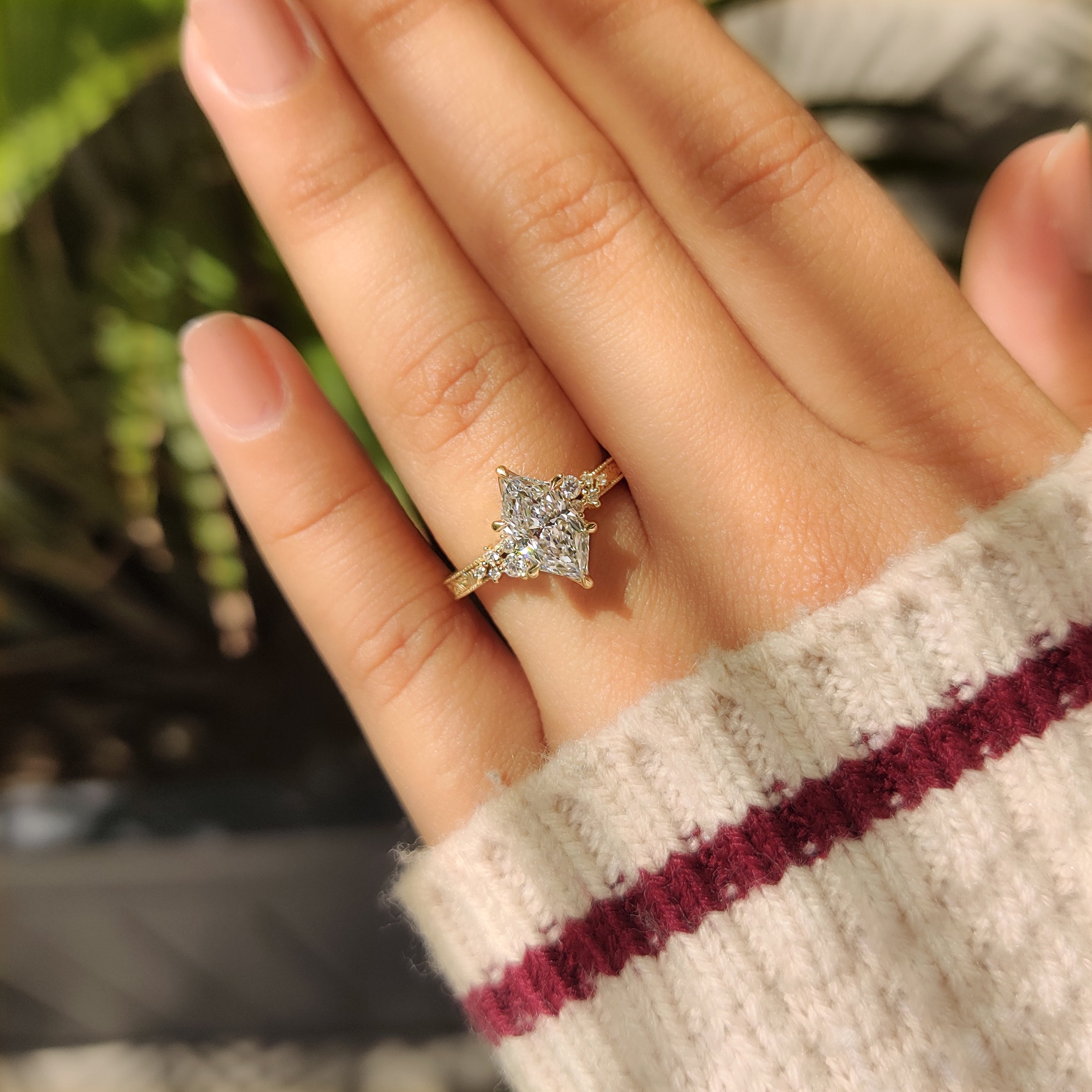Dutch marquise engagement ring with round accent side stones
