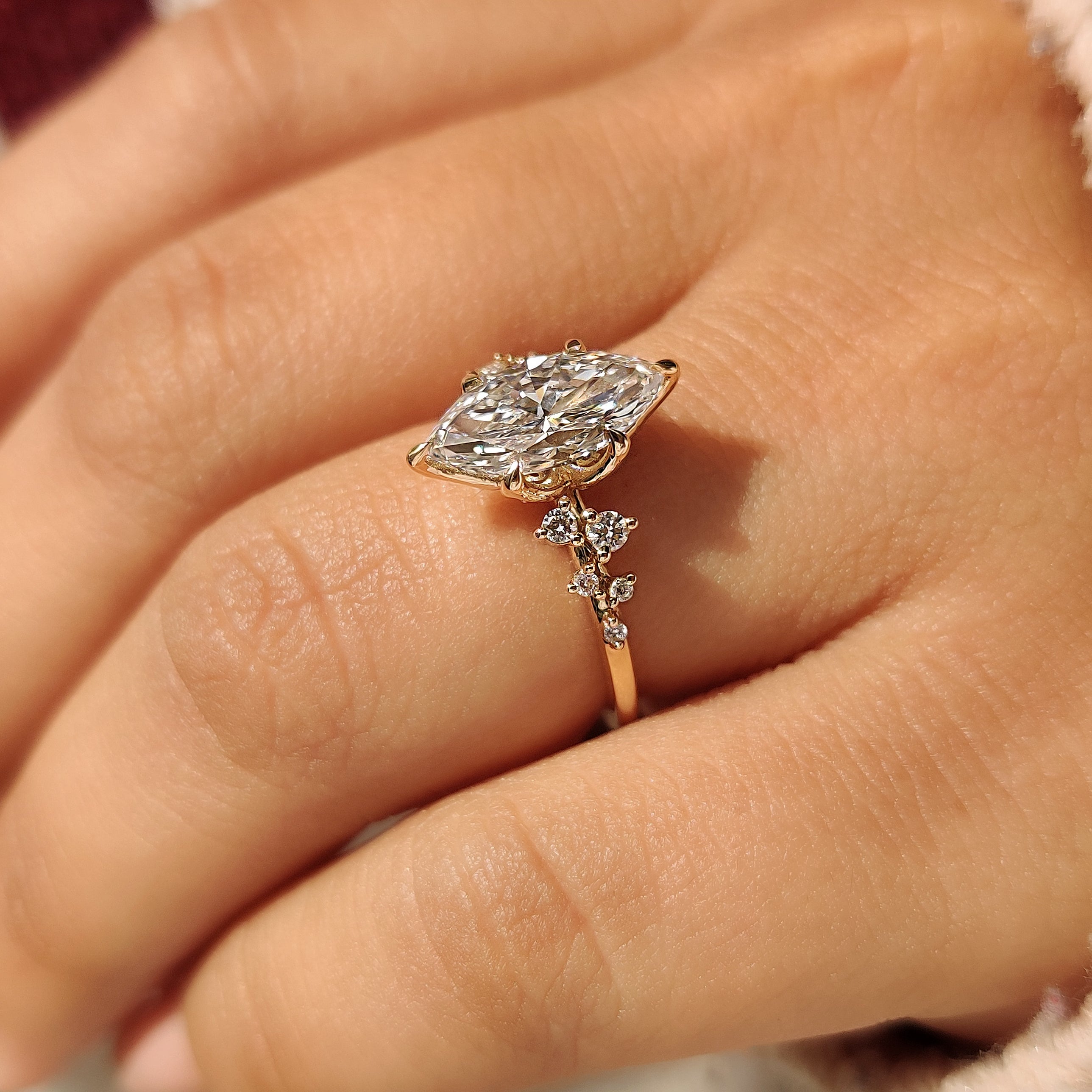 Marquise Lab Grown Diamond Ring with tulip setting and round side stones

