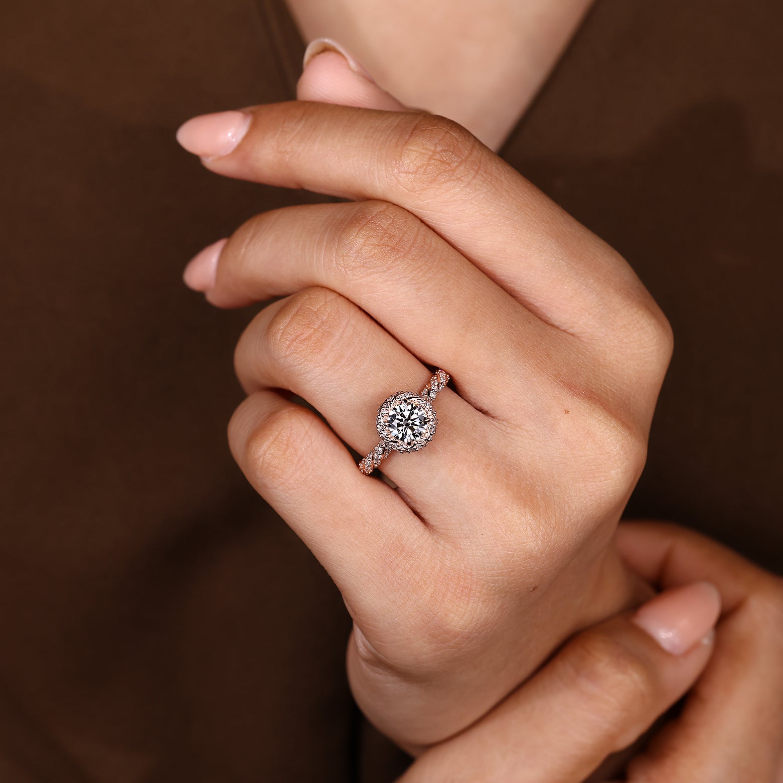 Carat Diamonds round ring with halo and pave design
