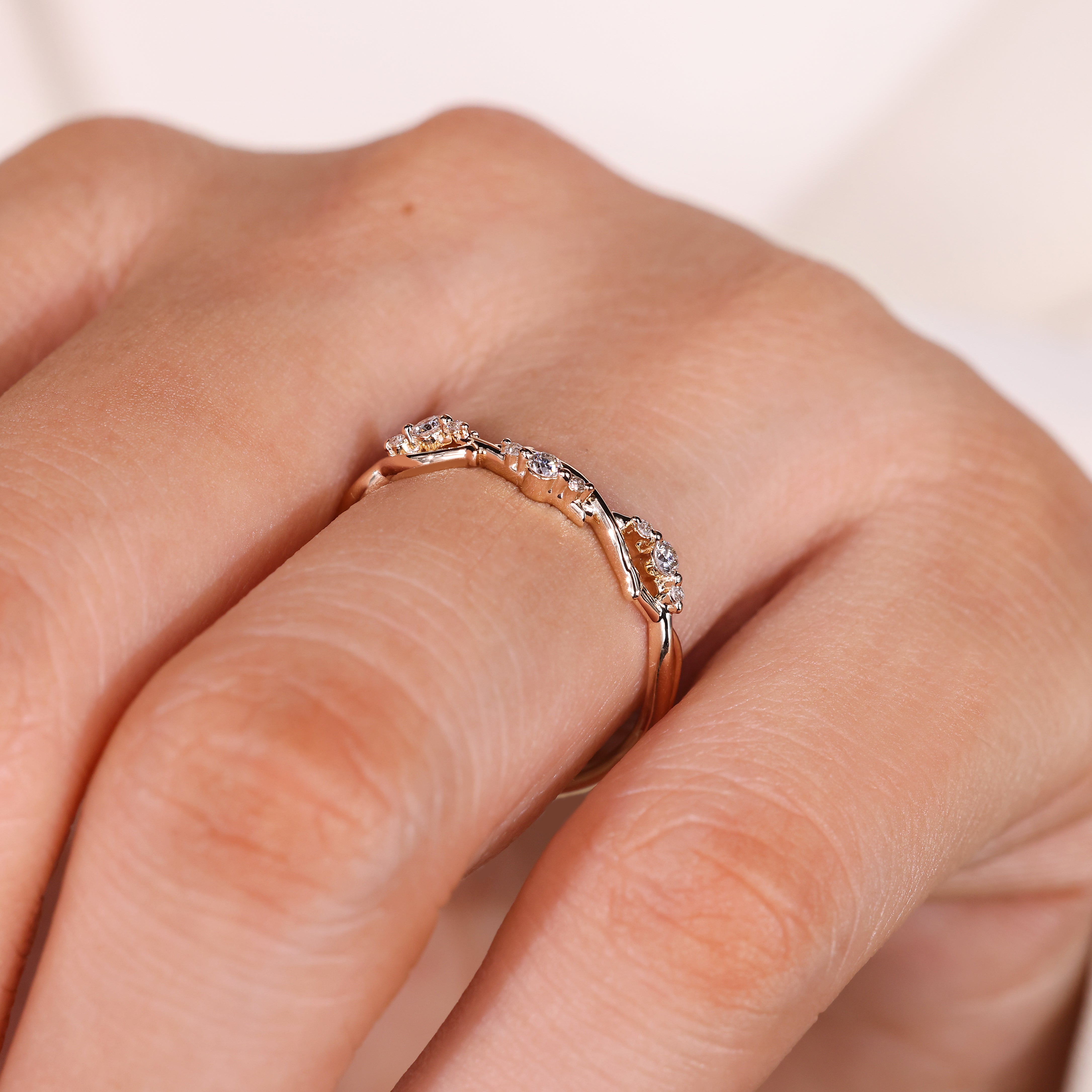Handmade round diamond wedding band with vine design
