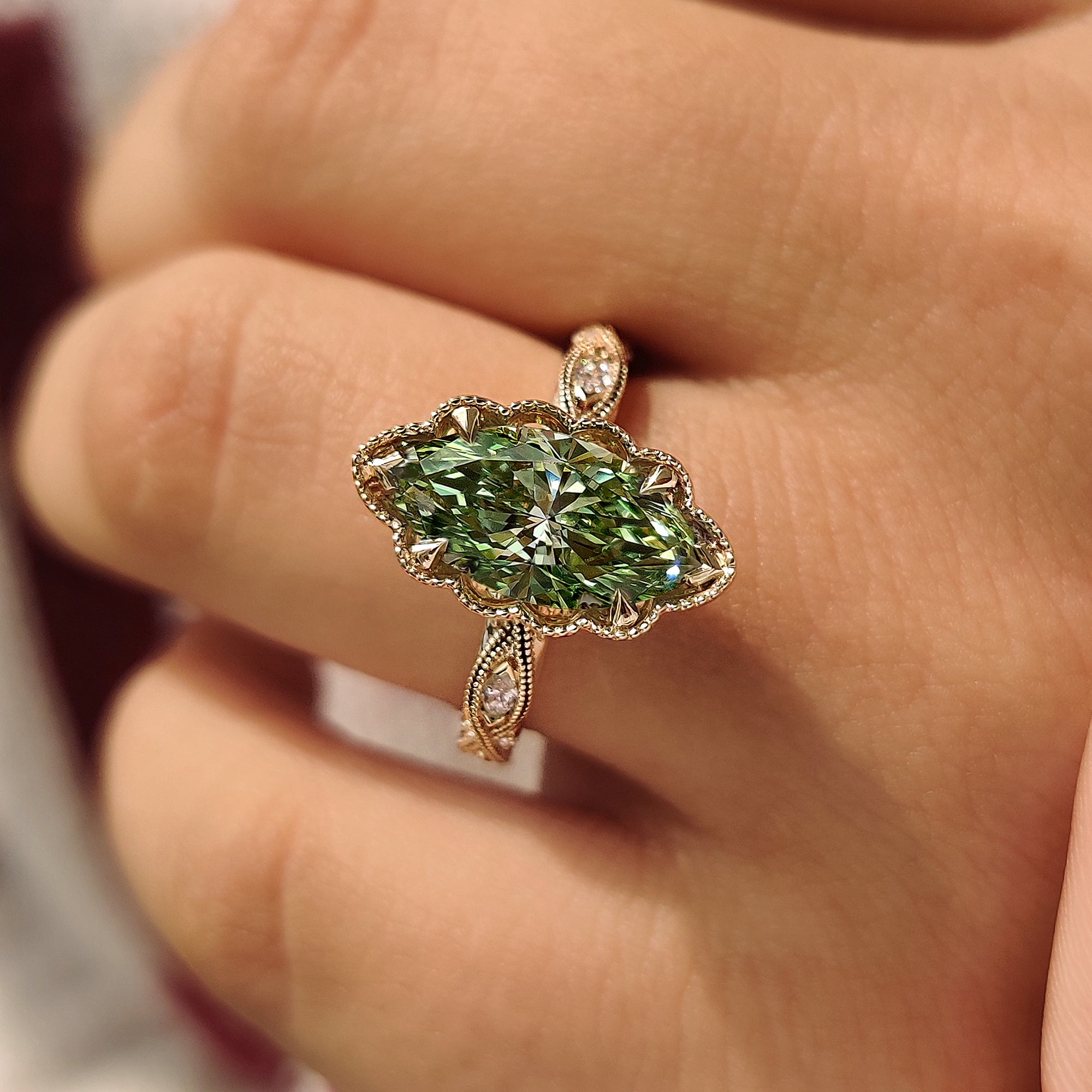 V shape prong green marquise diamond ring.
