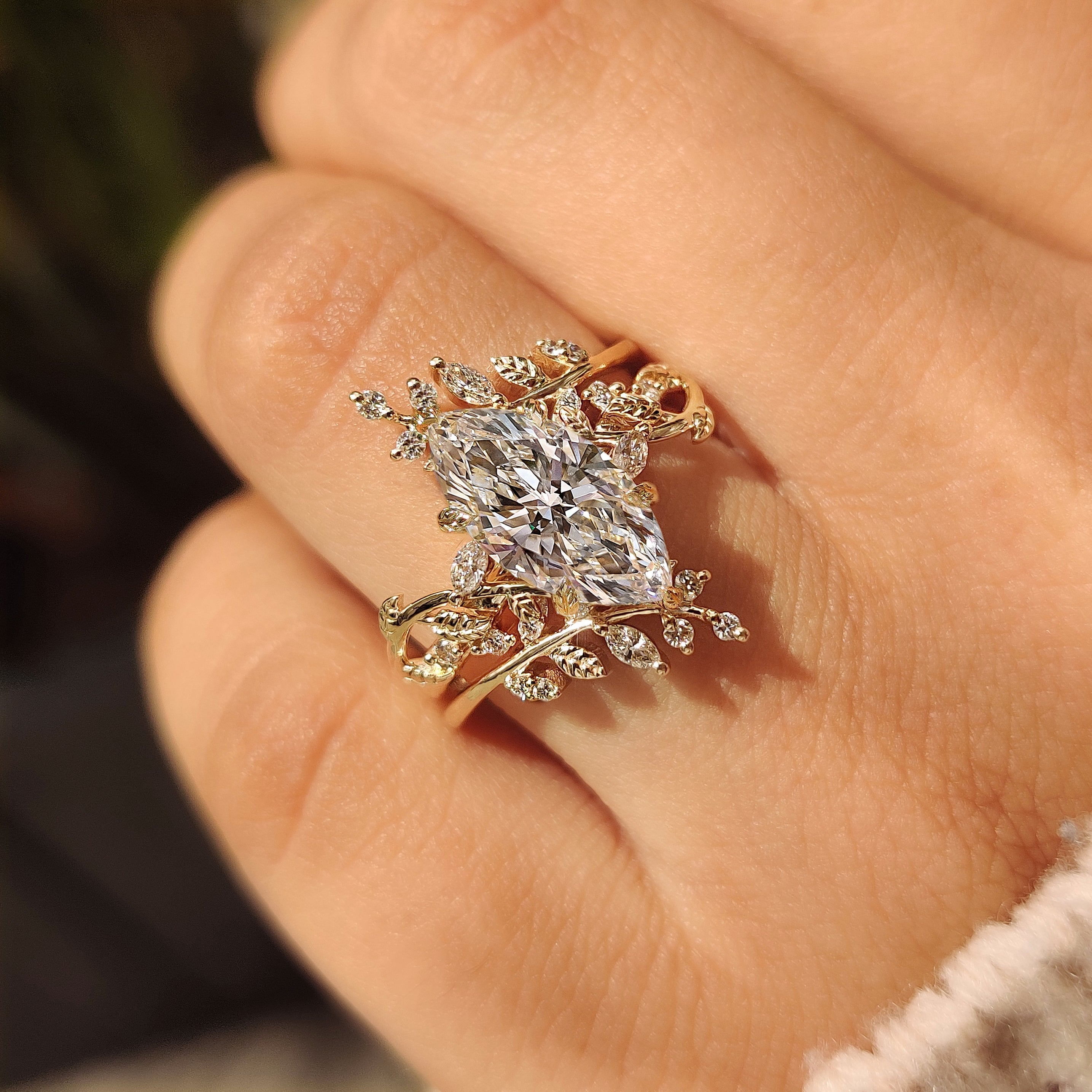 Nature inspired engagement ring with six leaf prong setting
