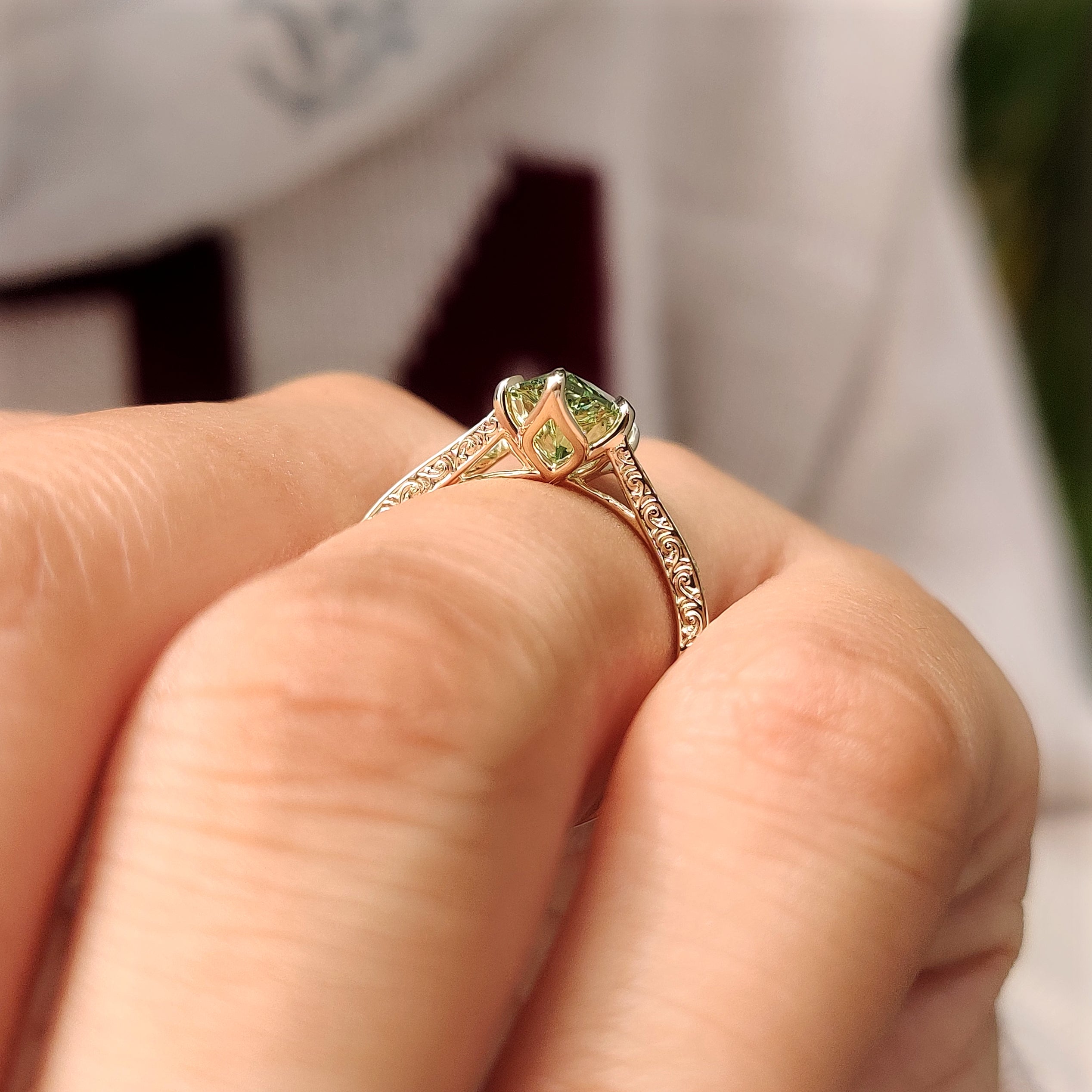 Green marquise diamond solitaire with vintage inspired style

