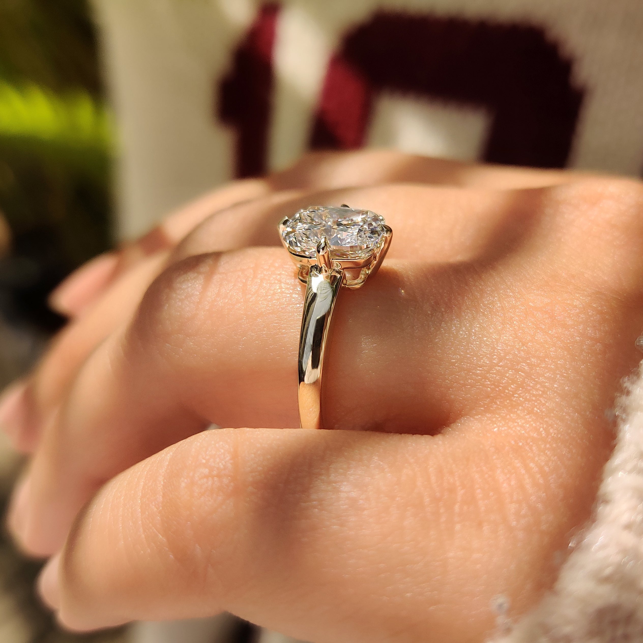 Lab grown cushion diamond ring with four claw prongs
